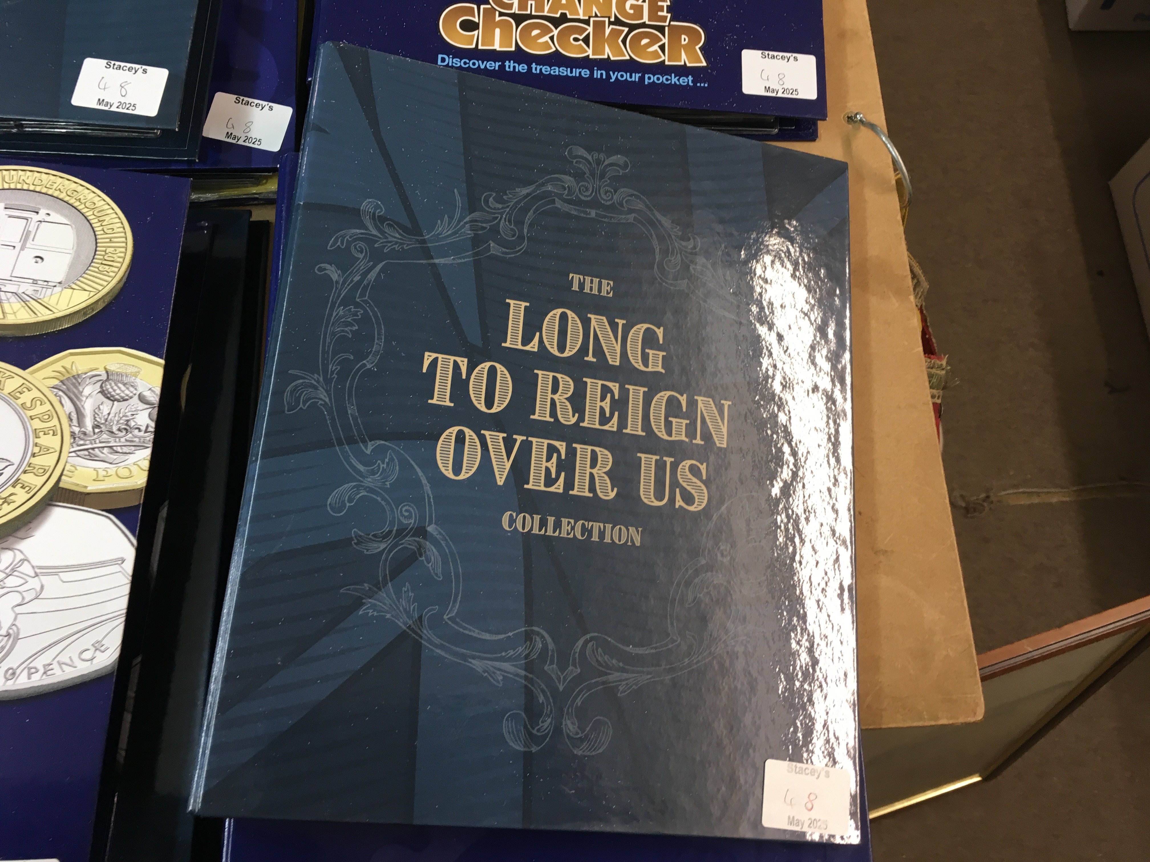 7 folders including change checker containing various 50p collections and &pound;5 coins