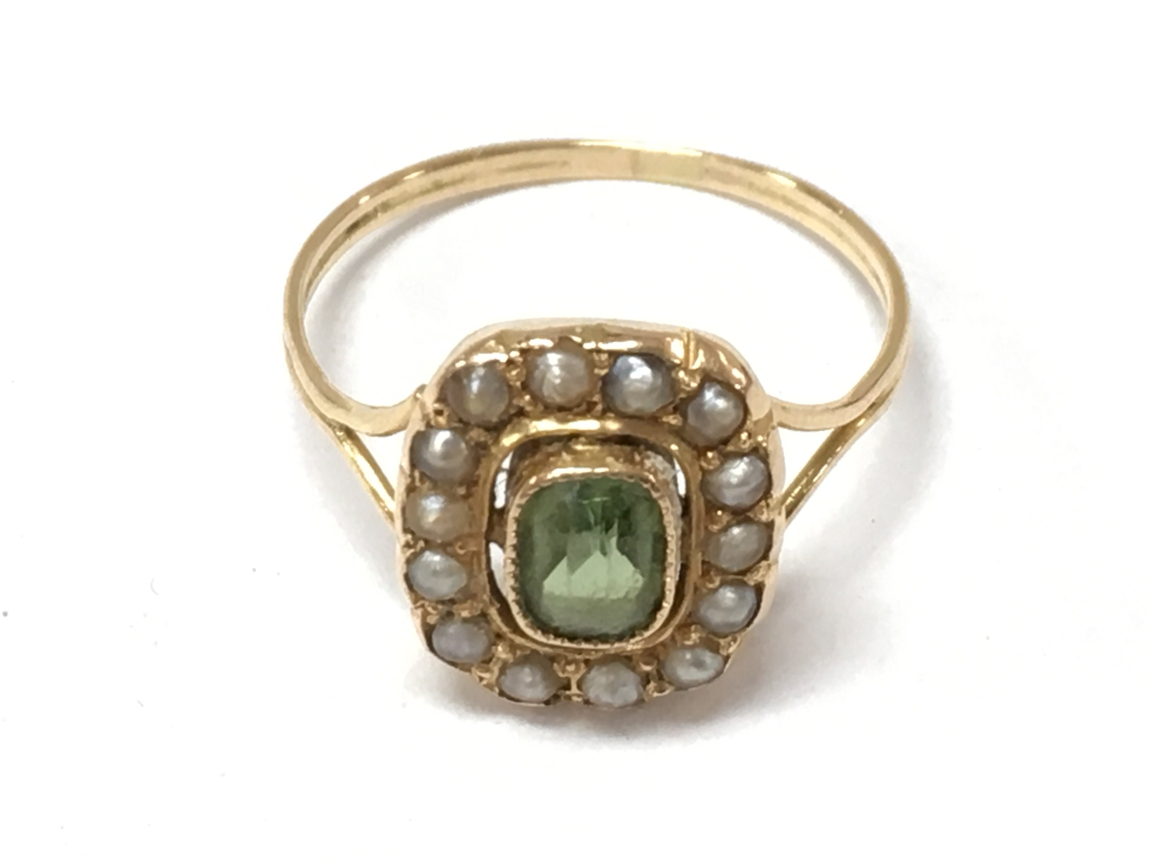 A peridot and seed pearl ring, size N, total weight 2.2g postage category a