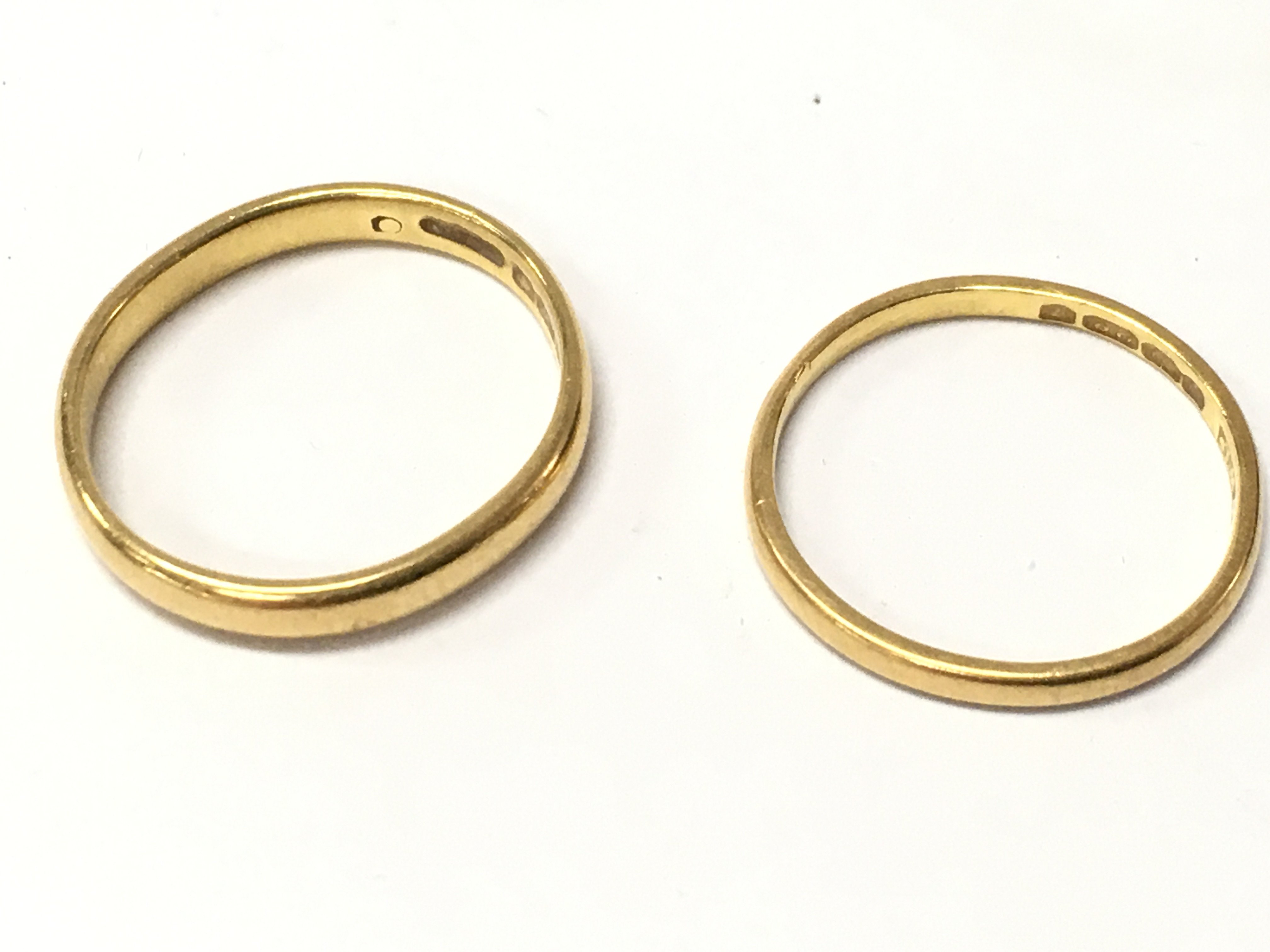 Two 22ct gold band rings, 4.8g total weight. Postage category A