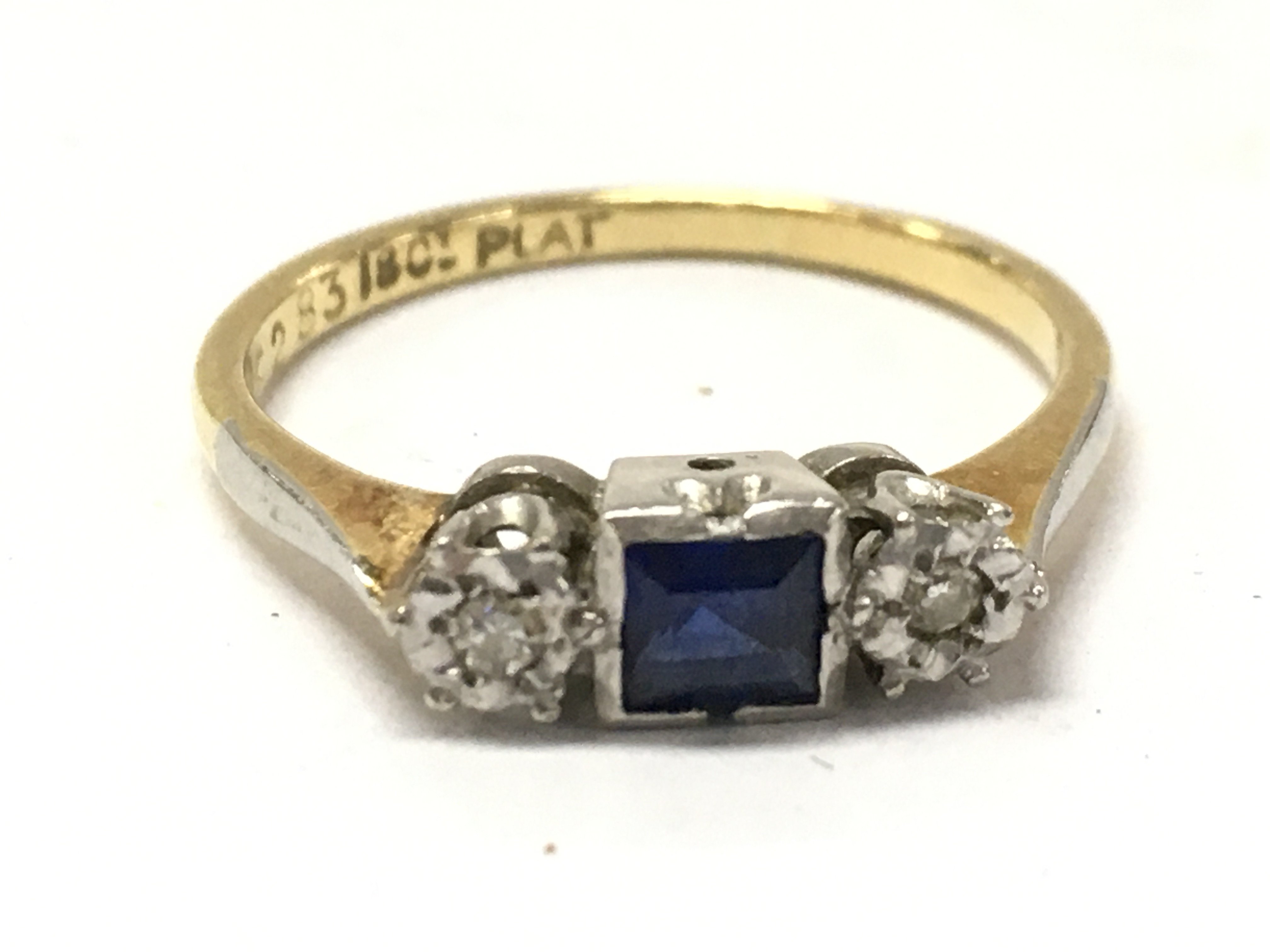 An art deco style 18ct gold and platinum sapphire ring , size M . 2.4 g total weight. Postage category A