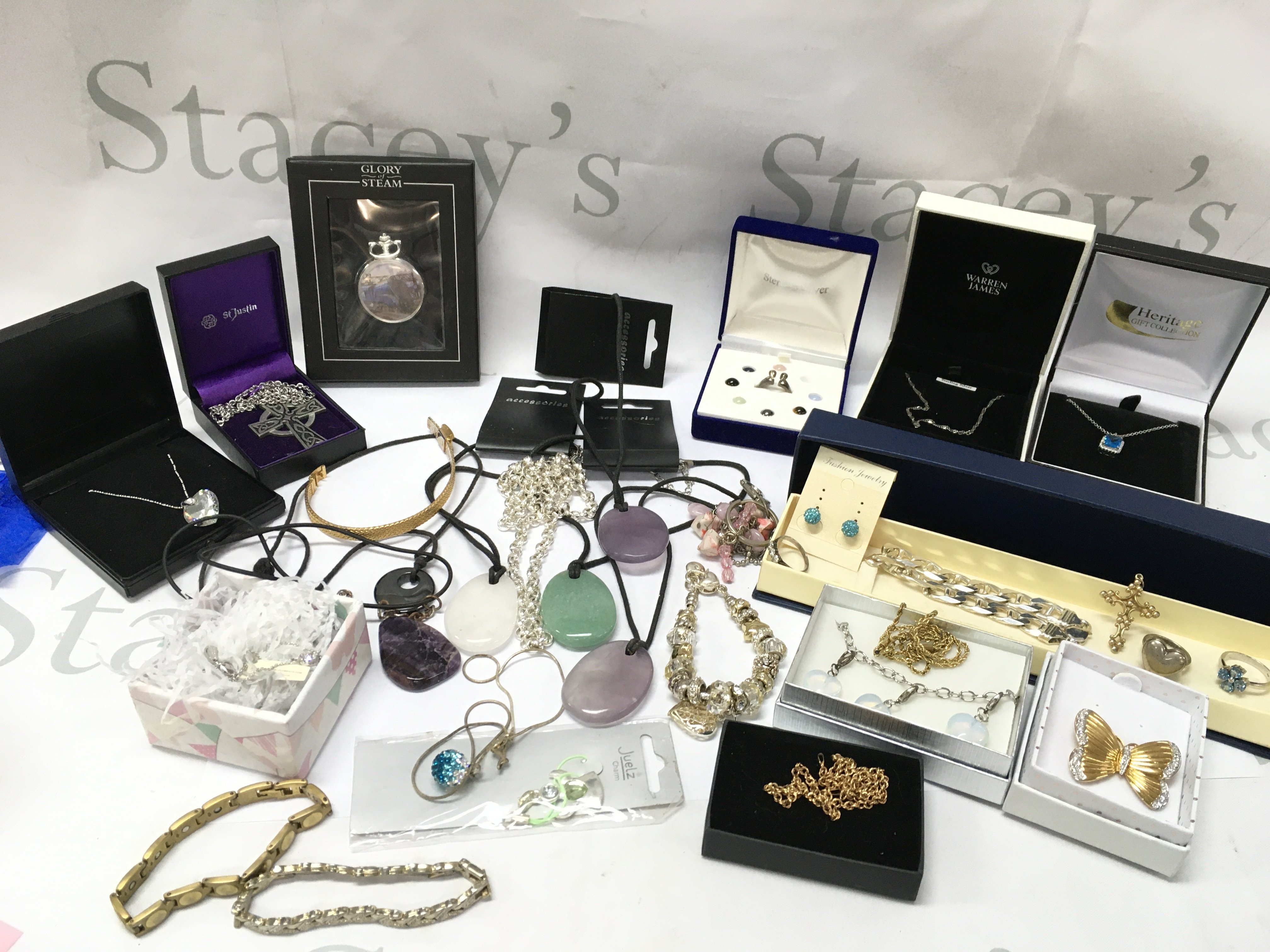A box of costume jewellery including silver rings, a small 9ct gold chain, stone pendant necklaces etc. postage category B