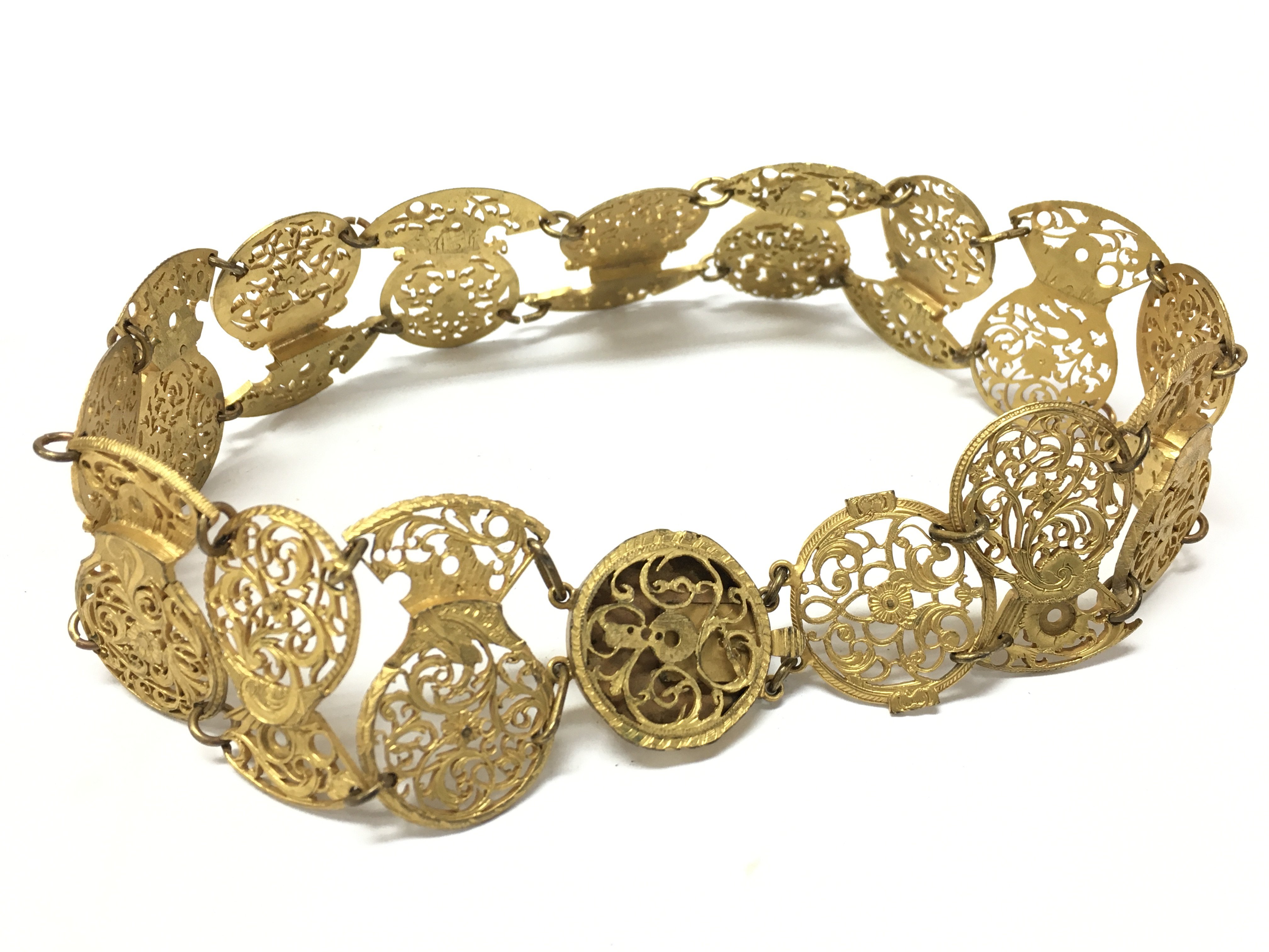 An Unusual necklace made from early pocket watch balance cocks . 17cm long . Postage category A