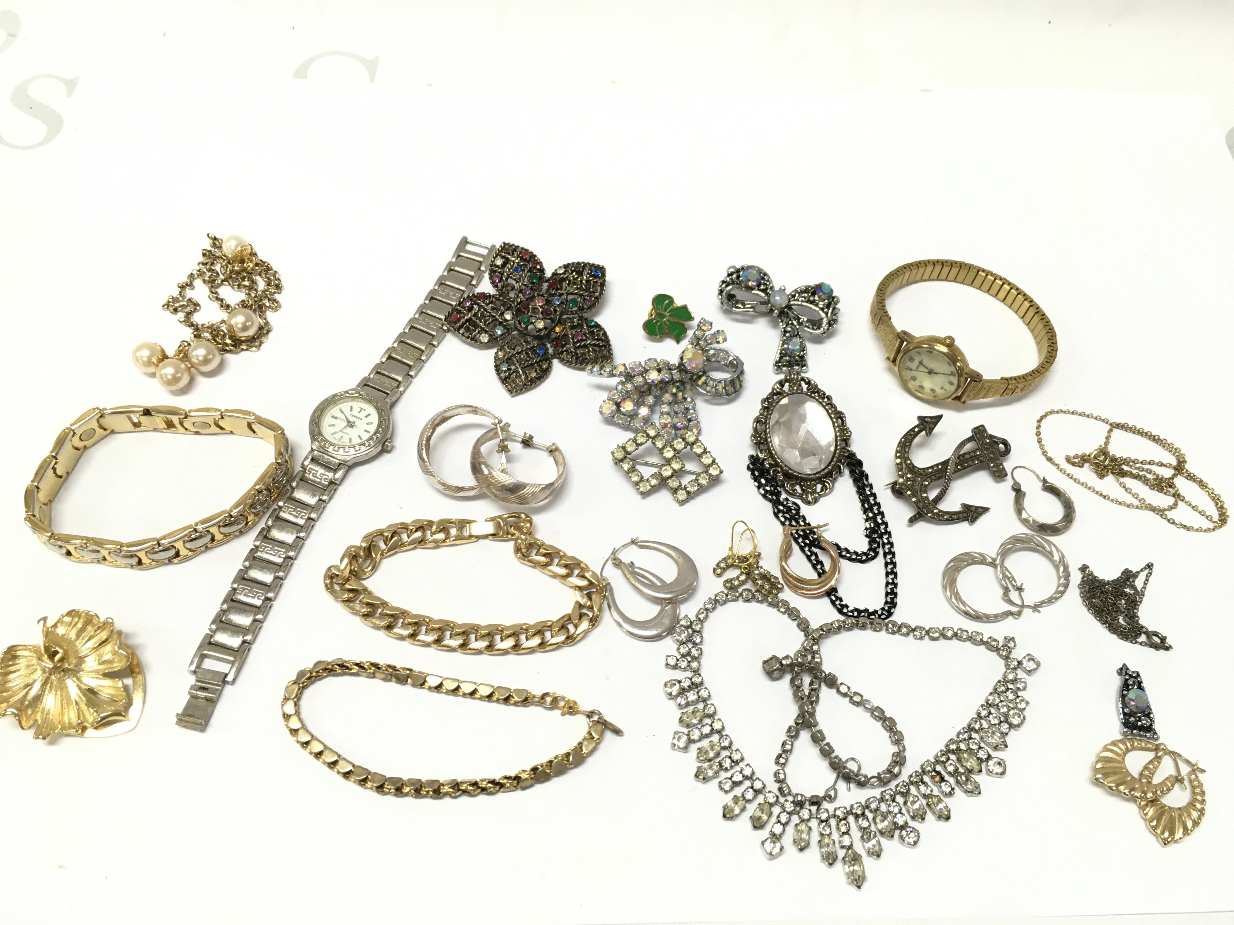 A collection of costume jewellery including watches, earrings, necklaces, 9ct gold earrings etc . Postage category A