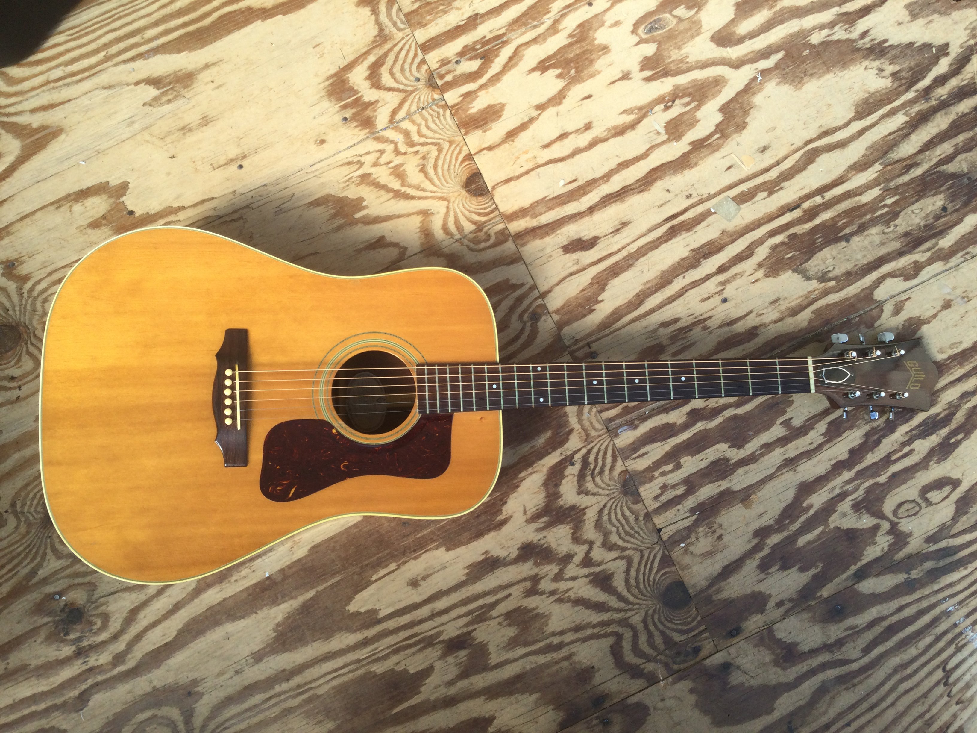A 1971 Guild D40-NT acoustic guitar, serial number 57023. Comes with hard carry case.