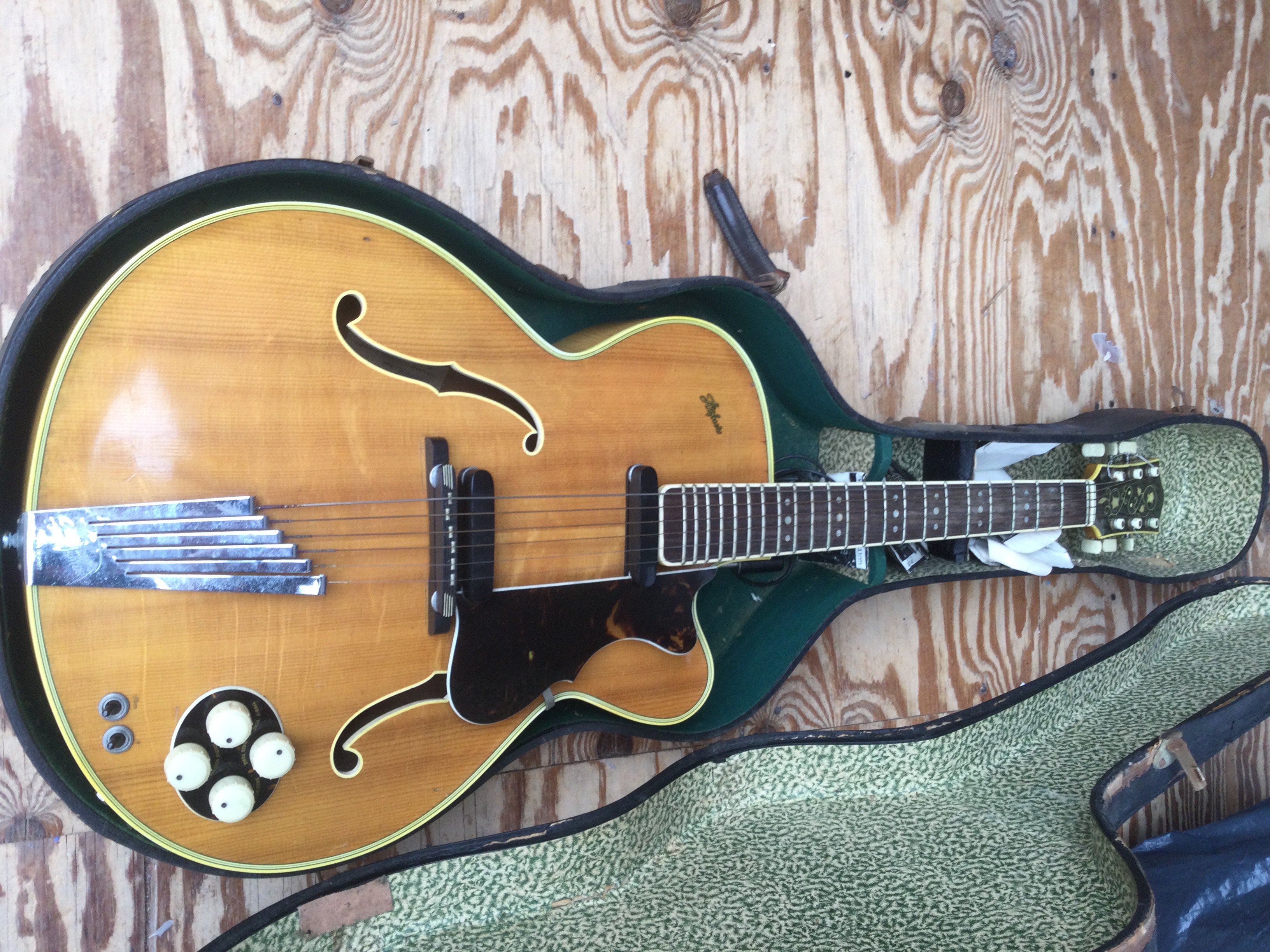 A circa 1950s Hofner President 2372 archtop guitar with rare round control panel. Comes with a hard carry case.
