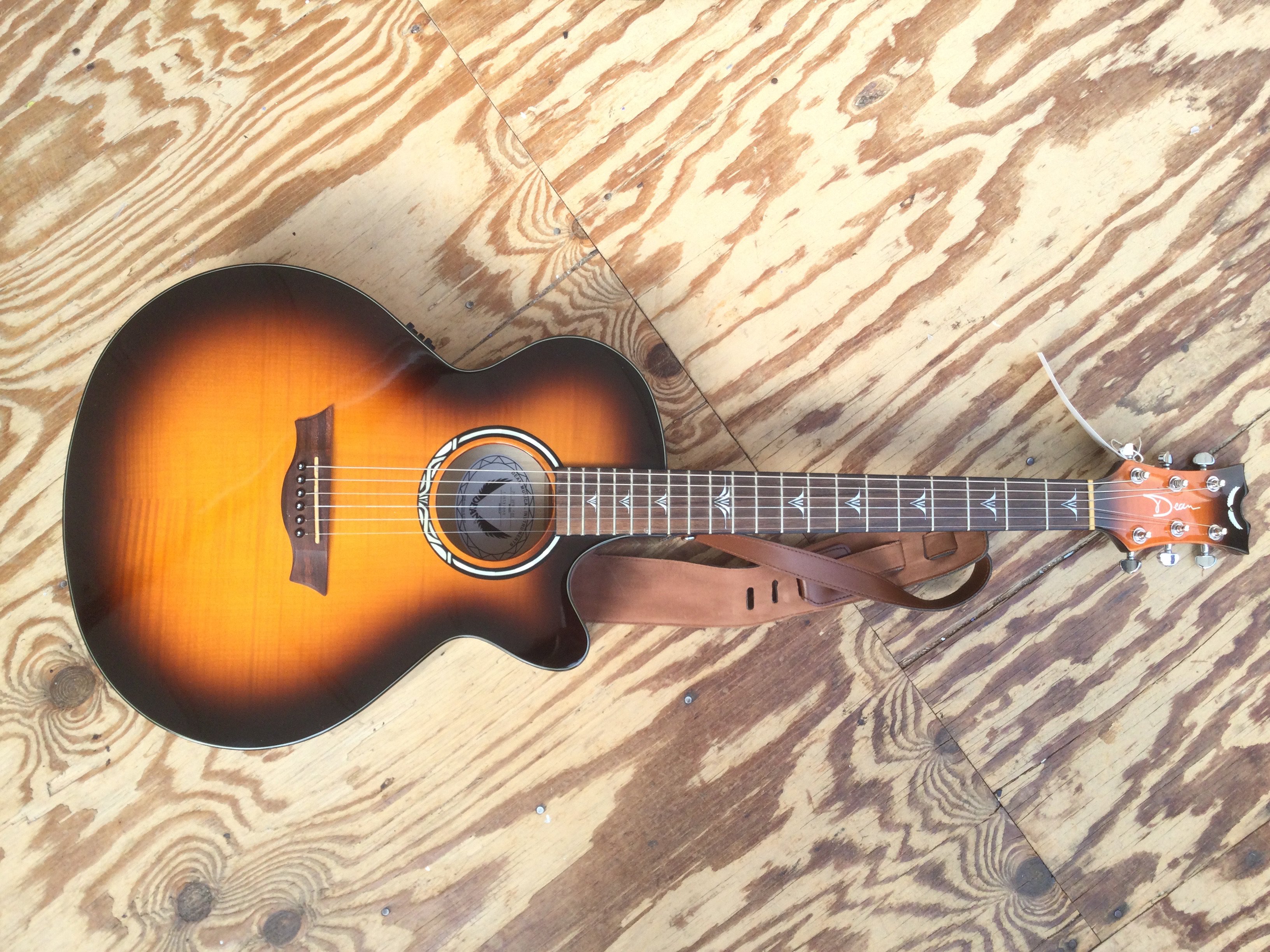 A Dean PE UFM TGE electro acoustic guitar. No case.