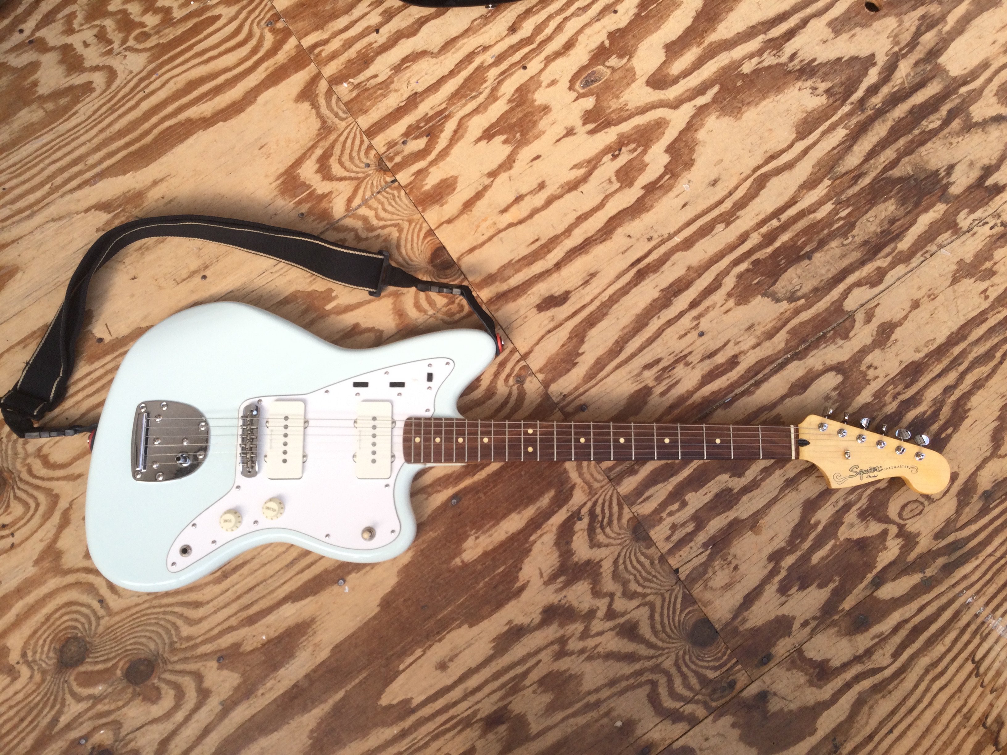 A Fender Squier Jazzmaster electric guitar in sonic blue. Comes with soft carry case.