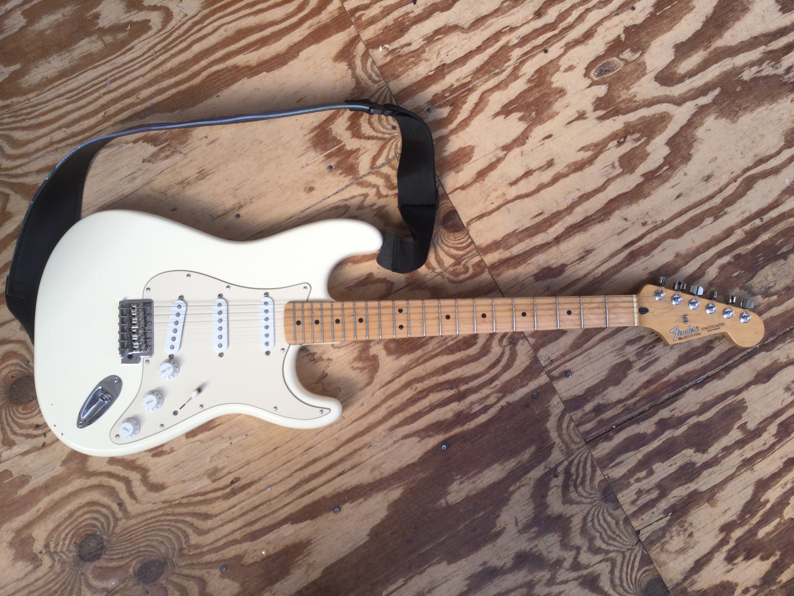 A 2005 Fender Stratocaster electric guitar, serial number MZ5203982. Comes with a soft carry case.