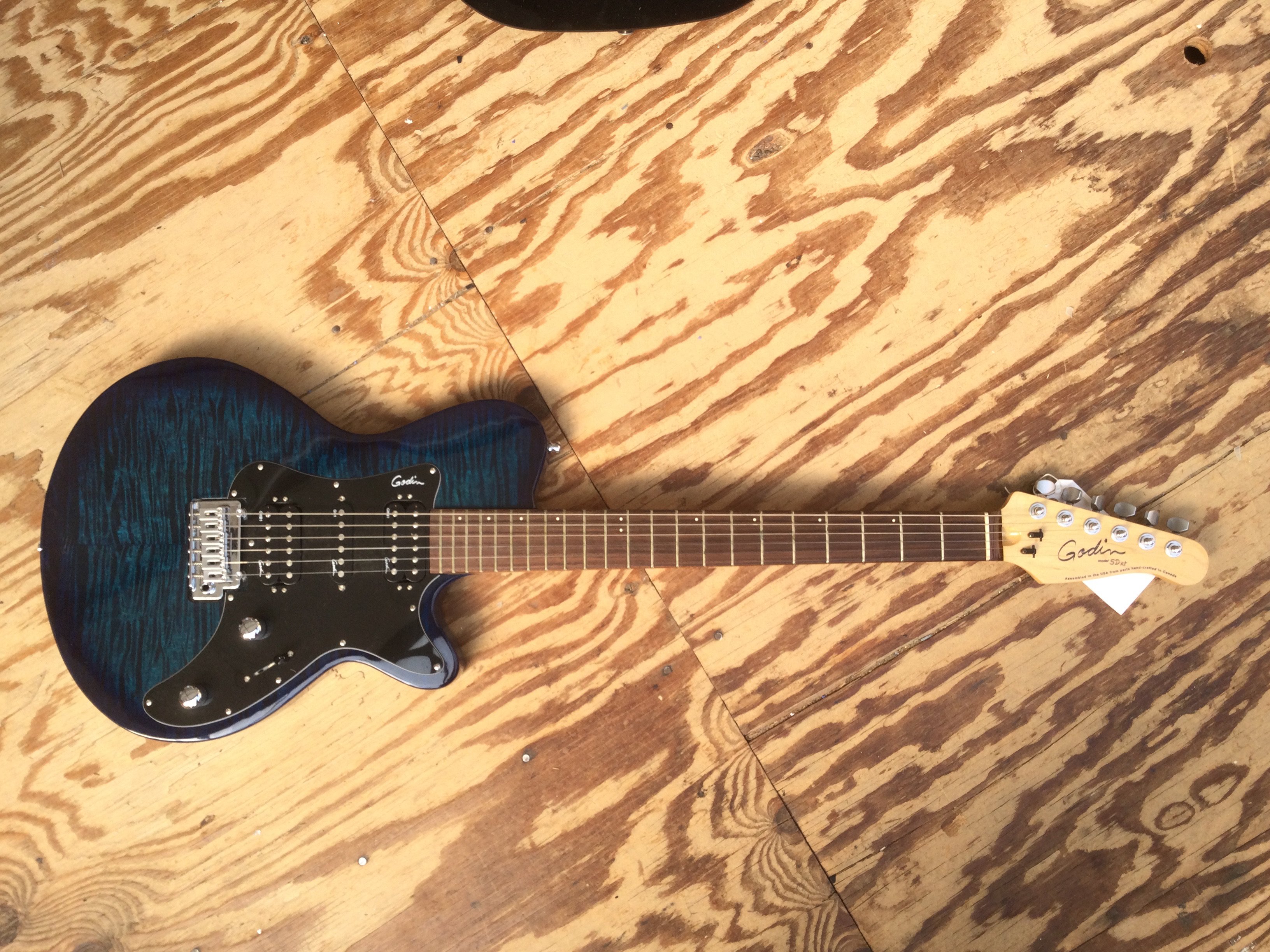 A Godin SDXT electric guitar. No case.