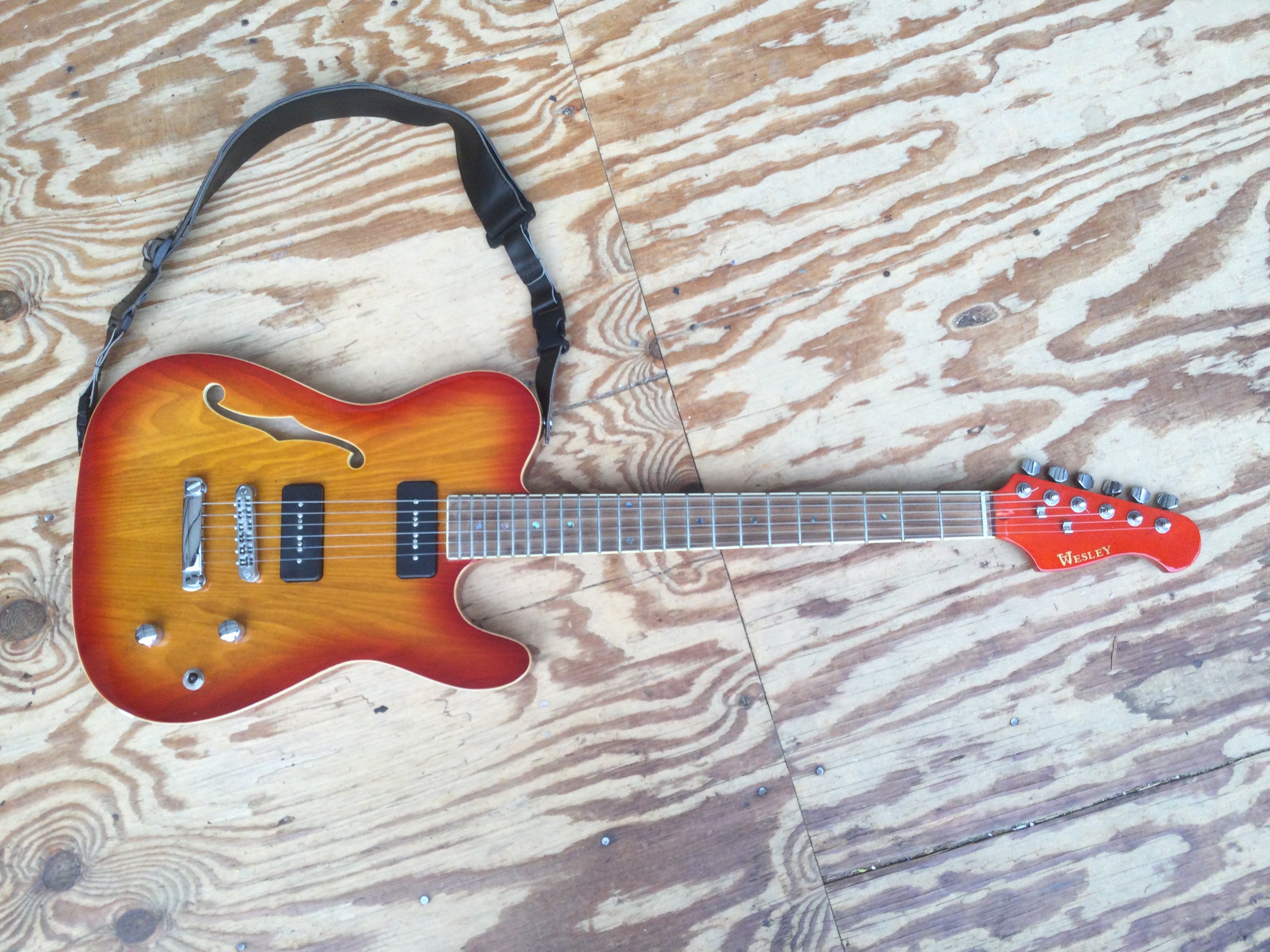 A Wesley Newport thinline Telecaster style electric guitar. Comes with a soft carry case.