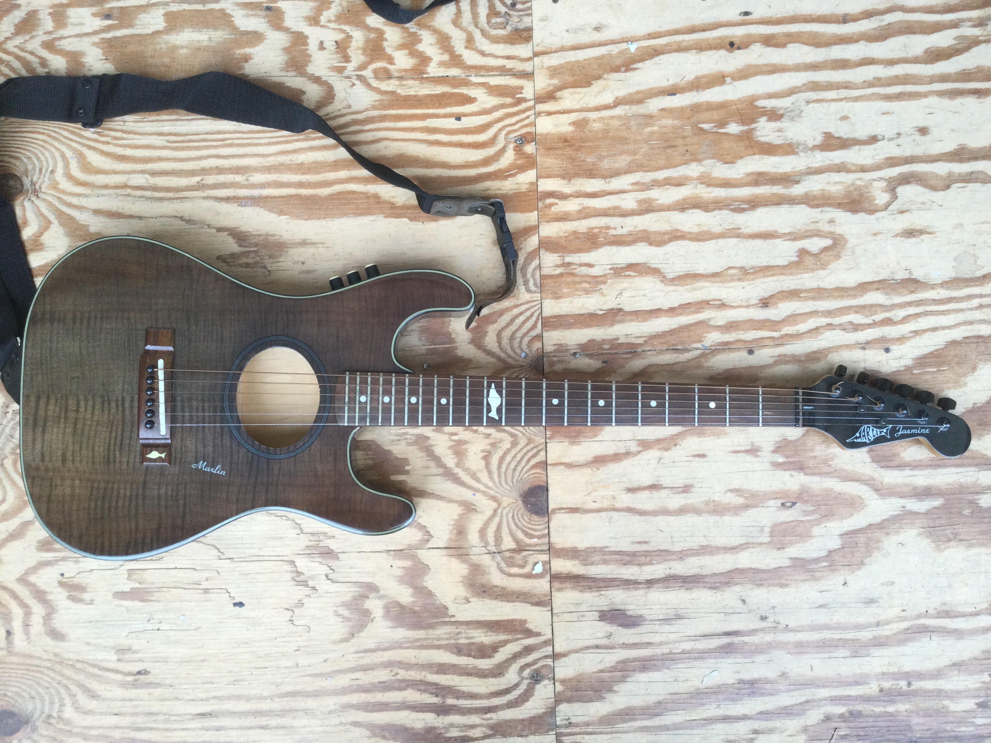 A Marlin Jasmine electro acoustic guitar. Comes with a soft carry case.