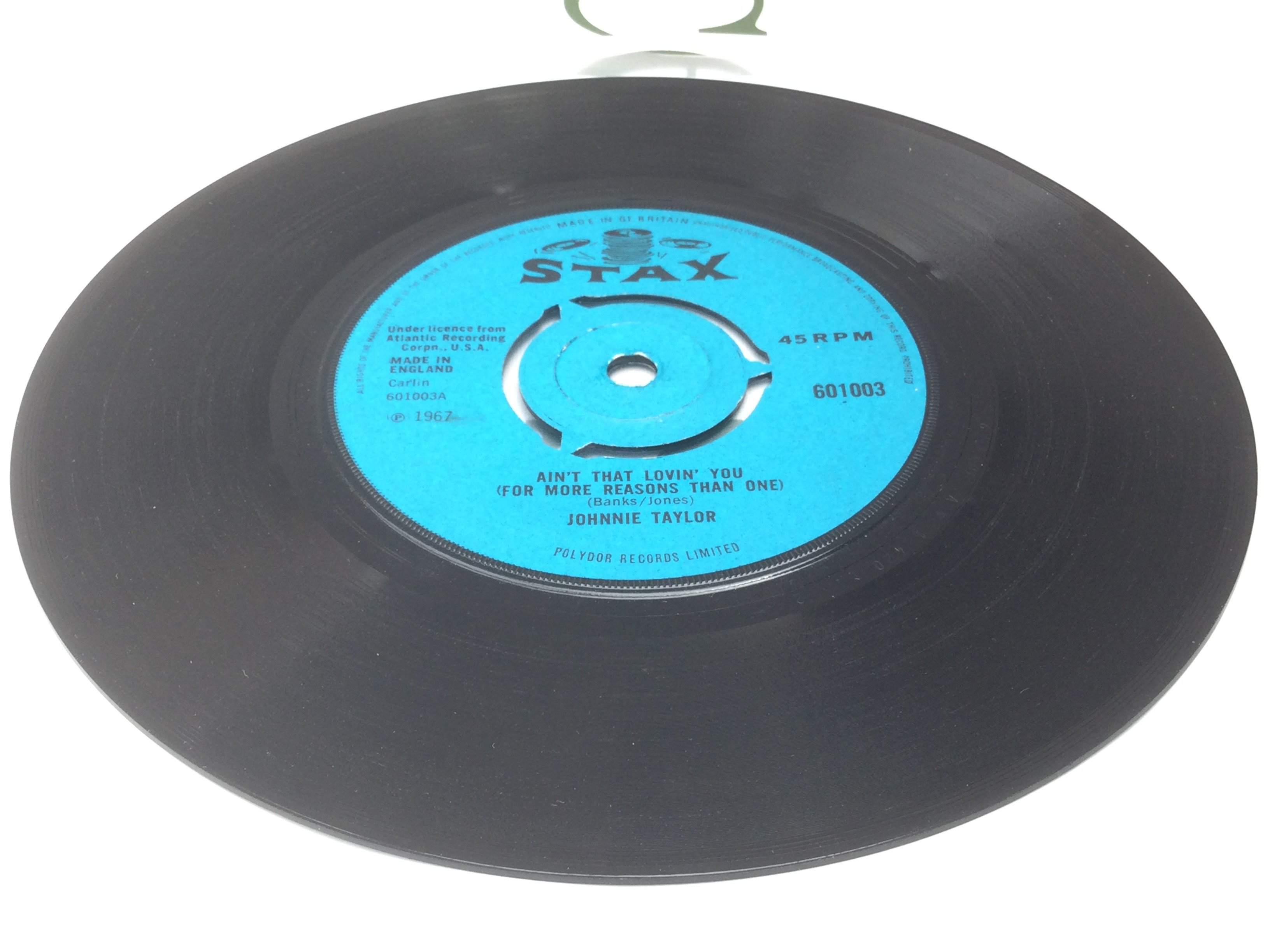 A rare Stax 7" single by Johnnie Taylor of Aint That Lovin You b/w Outside Love. Condition Ex.