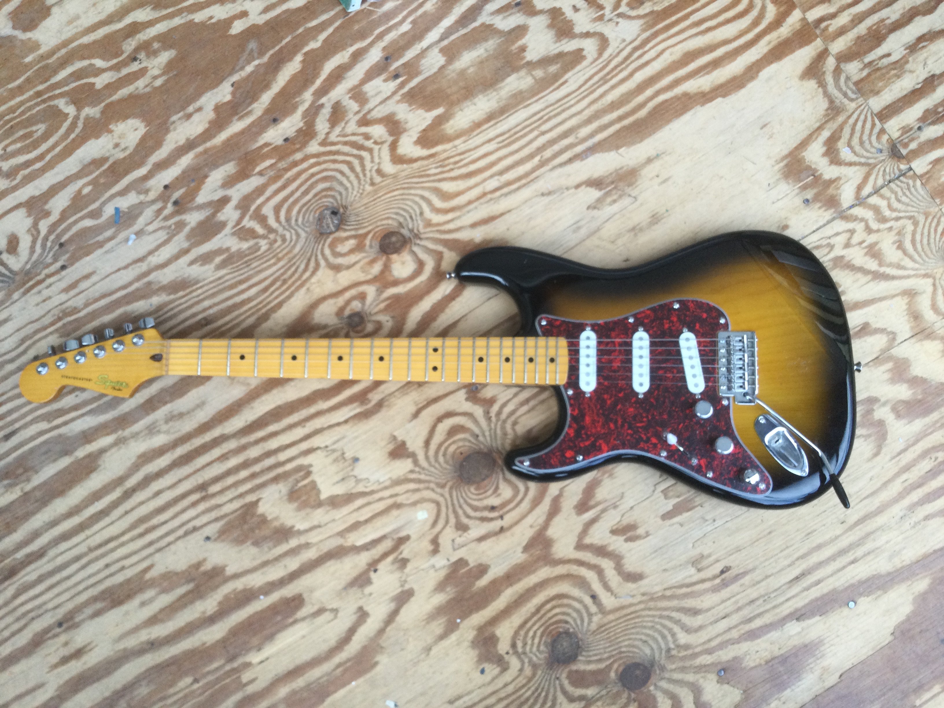 A left handed Fender Squier Stratocaster electric guitar. This is a Monterey Pop Festival reissue with upgraded Seymour Duncan pickups and Fender tuners. No case.