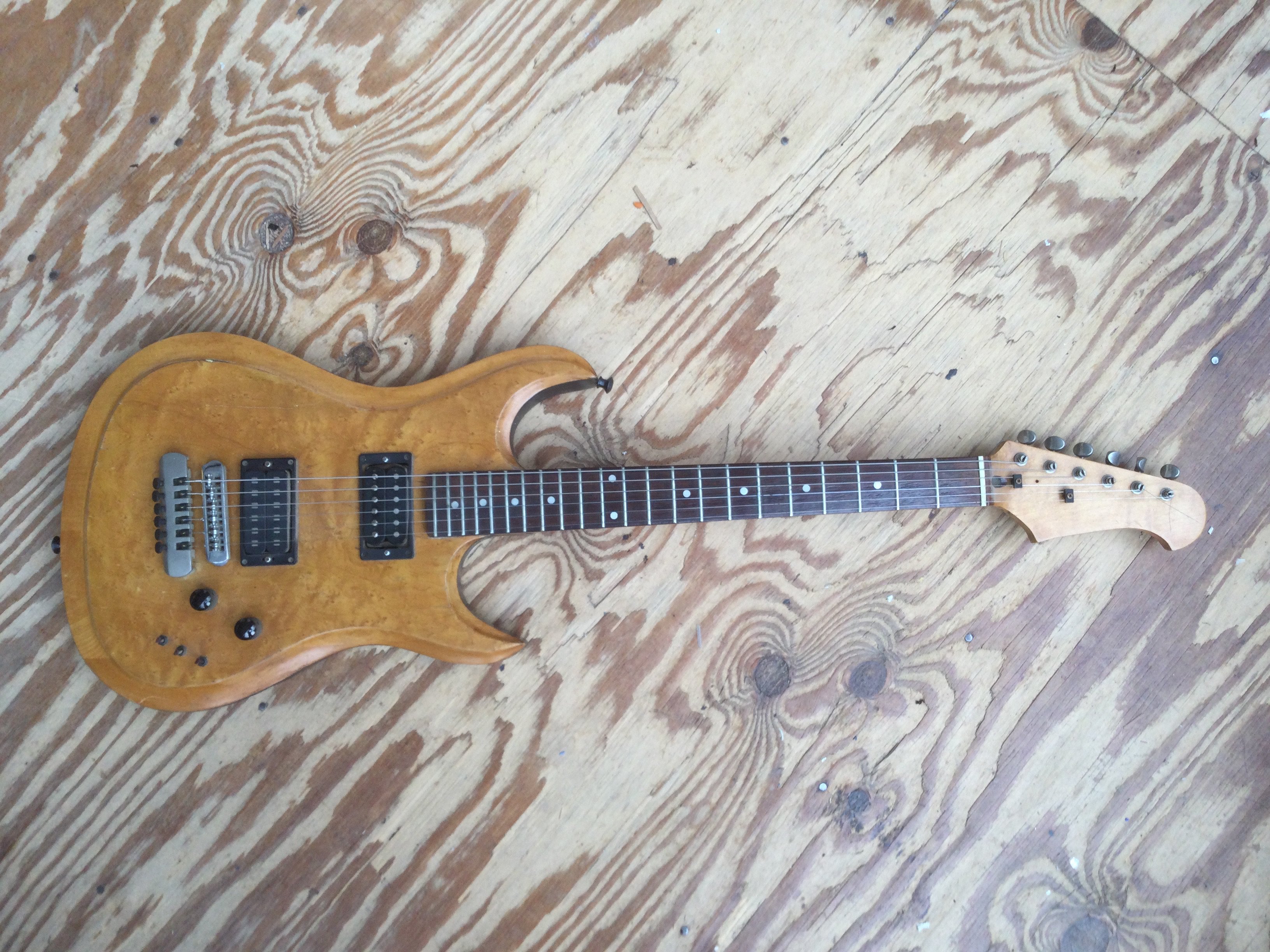 A scratch built electric guitar fitted with two humbuckers, grover tuners and a birds eye maple finish plus one other scratch built electro acoustic guitar fitted with a Seymour Duncan pickup. No cases. (2).