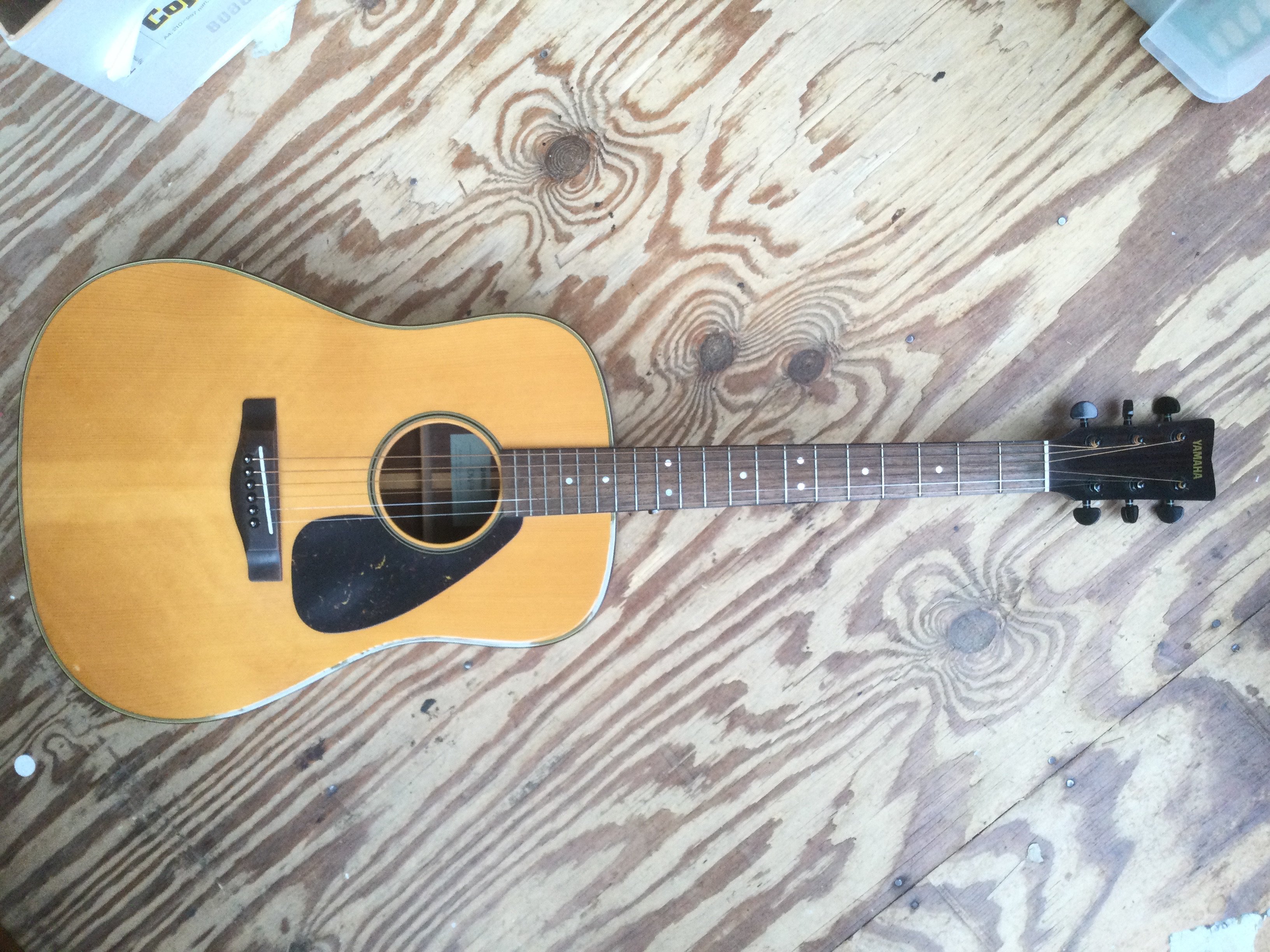 A Yamaha DW-9 acoustic guitar. Has had replacement tuners fitted. Comes with a soft carry case.