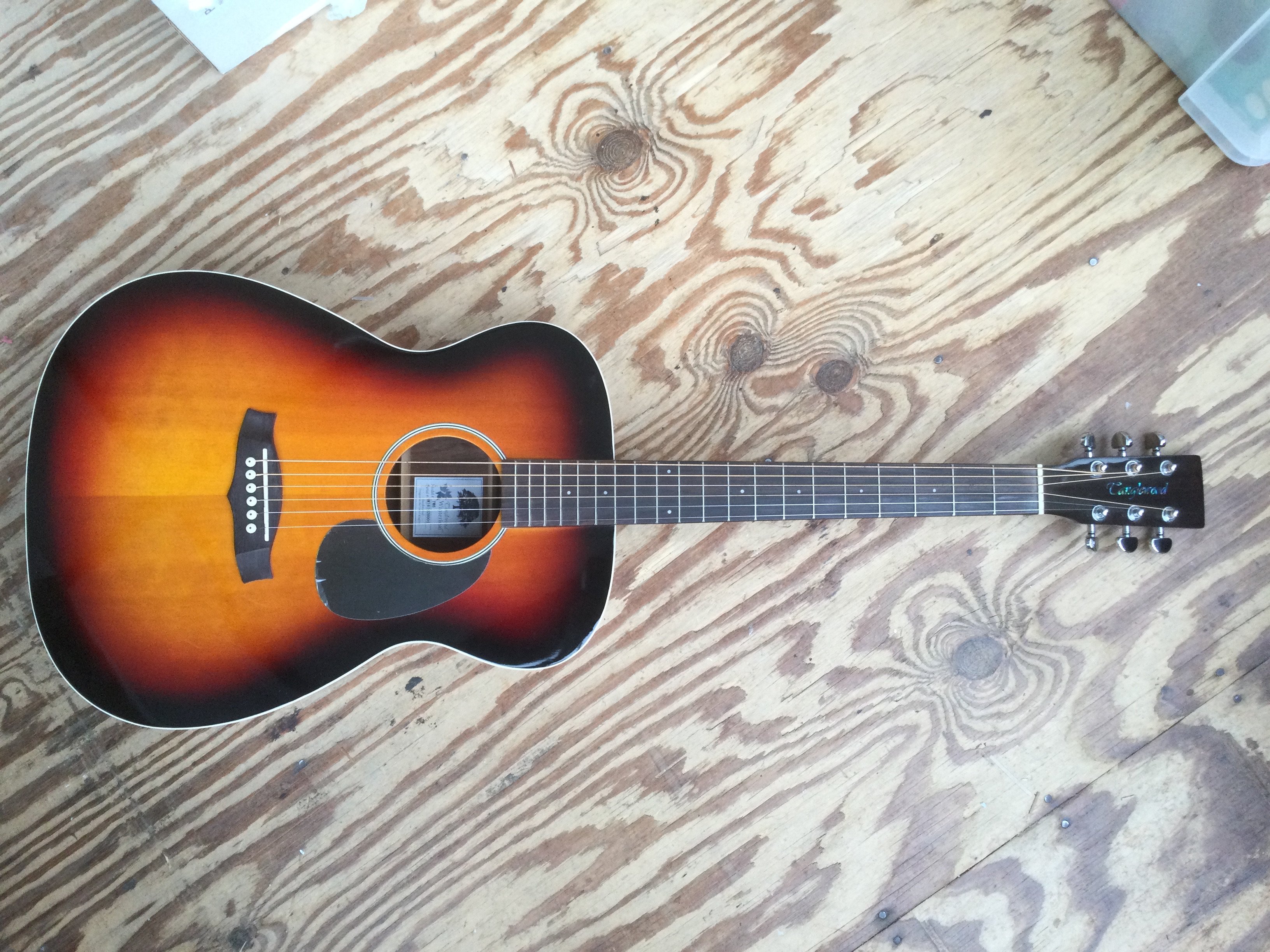 A Tanglewood TW6 Winterleaf acoustic guitar and a Kimbara bowl back acoustic guitar. Both with soft carry cases.