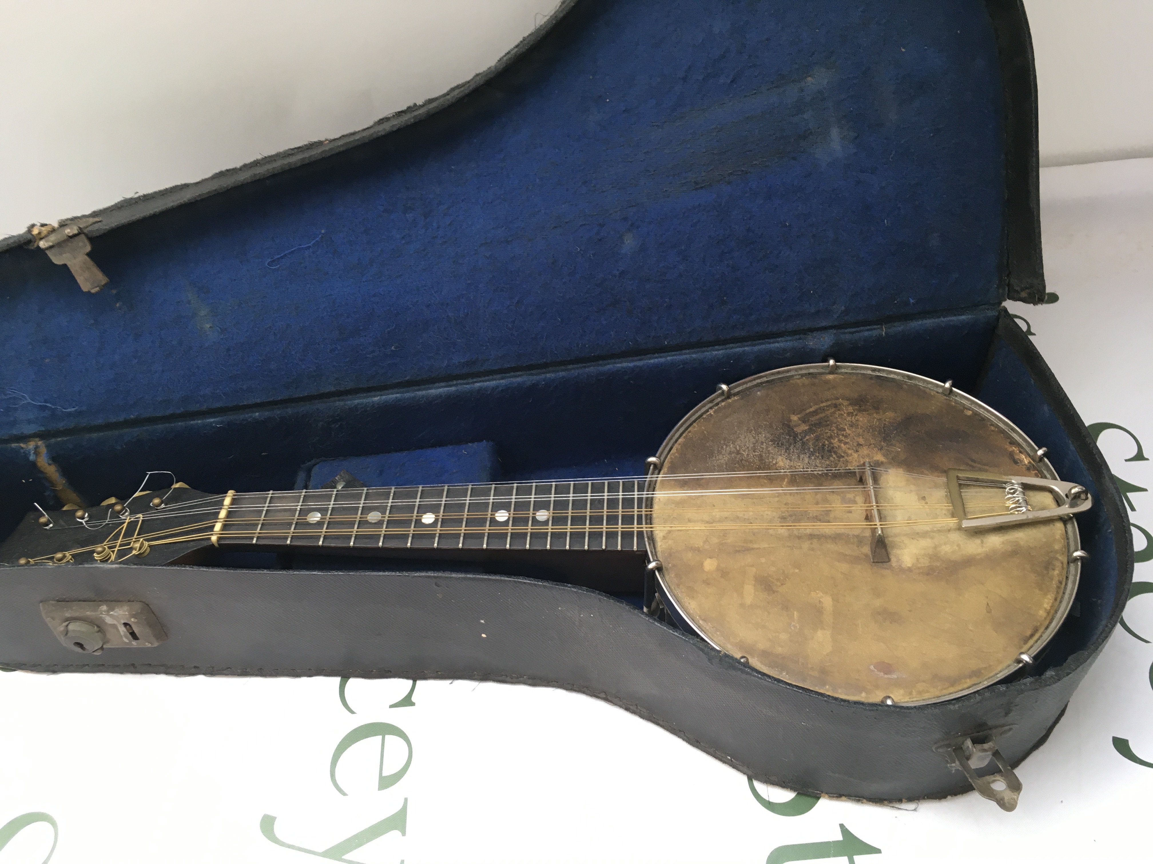 A cased open backed banjolele by J Wallis of London.