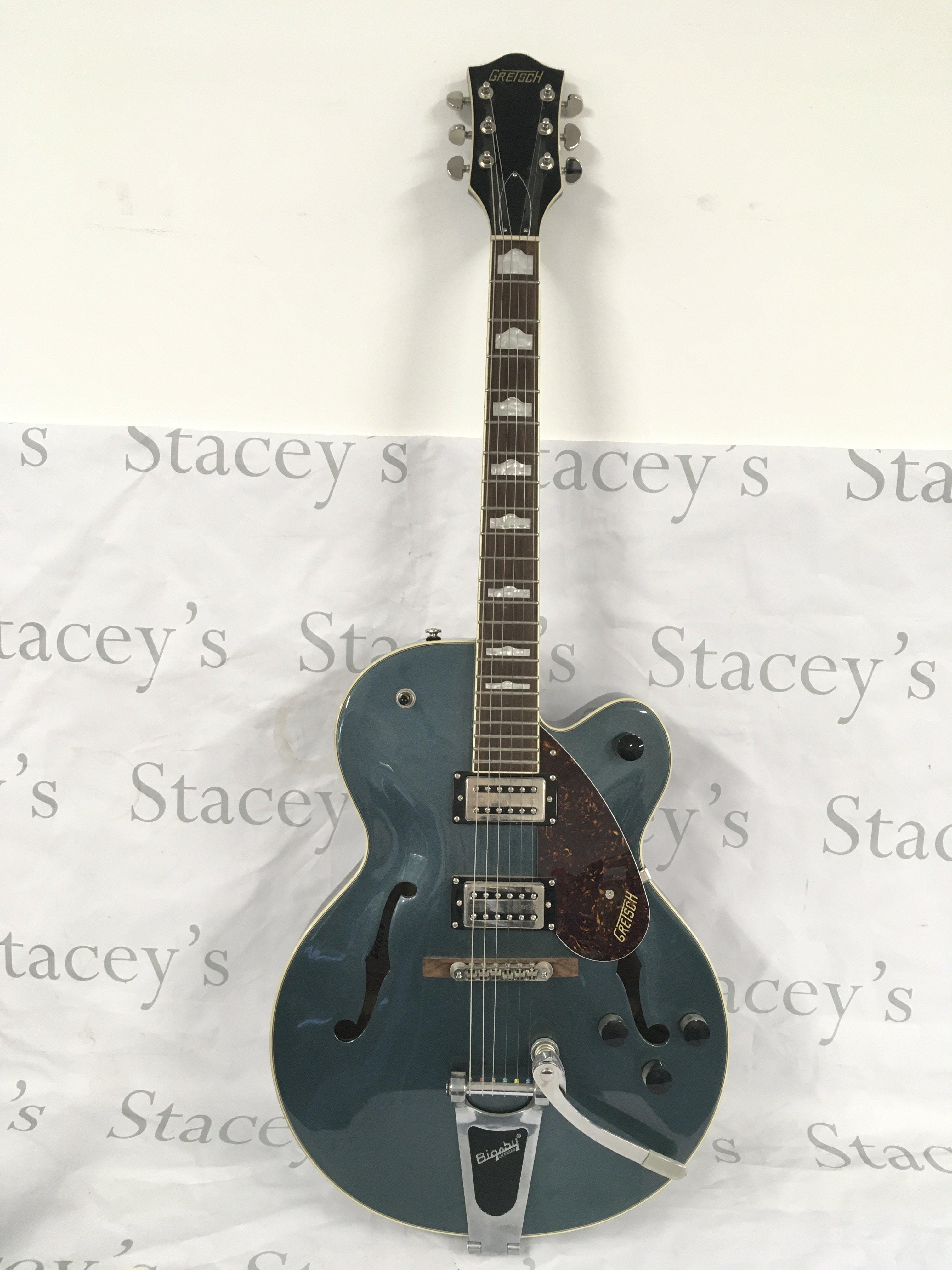 A Gretsch G2420T electric guitar with original Gretsch branded hard carry case.