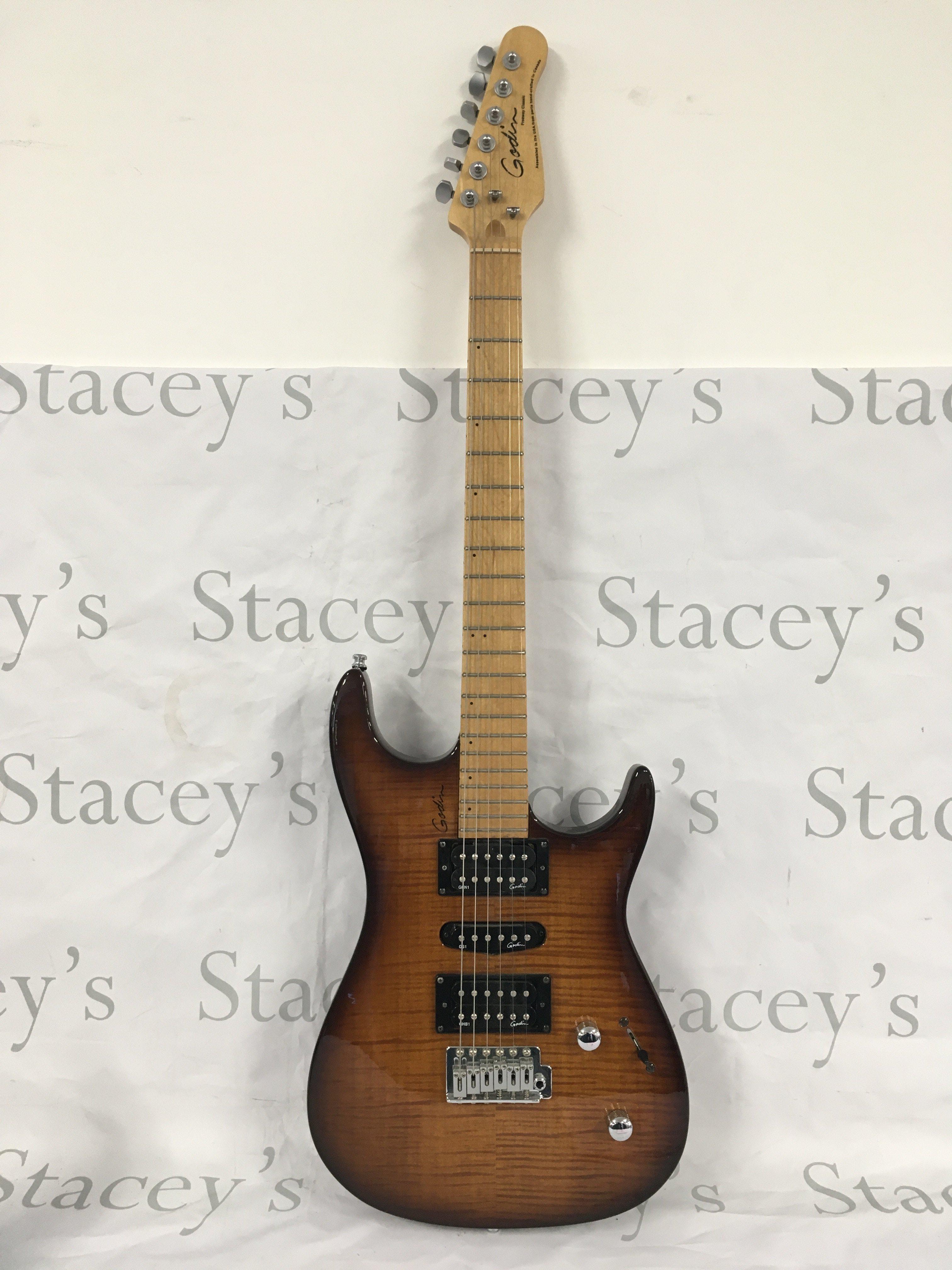 A Godin Freeway Classic electric guitar with original soft carry case.