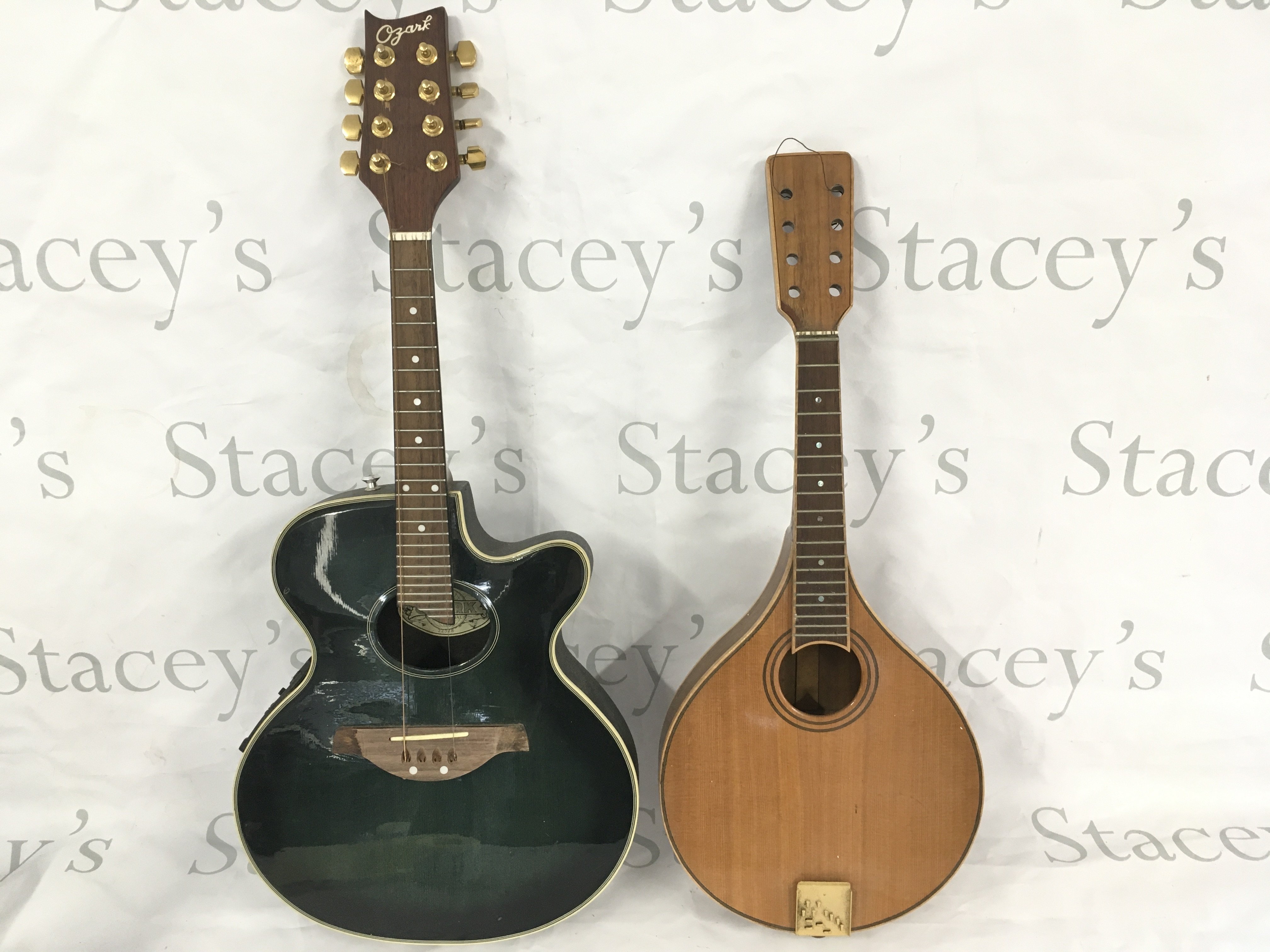 An Ozark 8 string electro mandolin with case plus one other eight string mandolin.