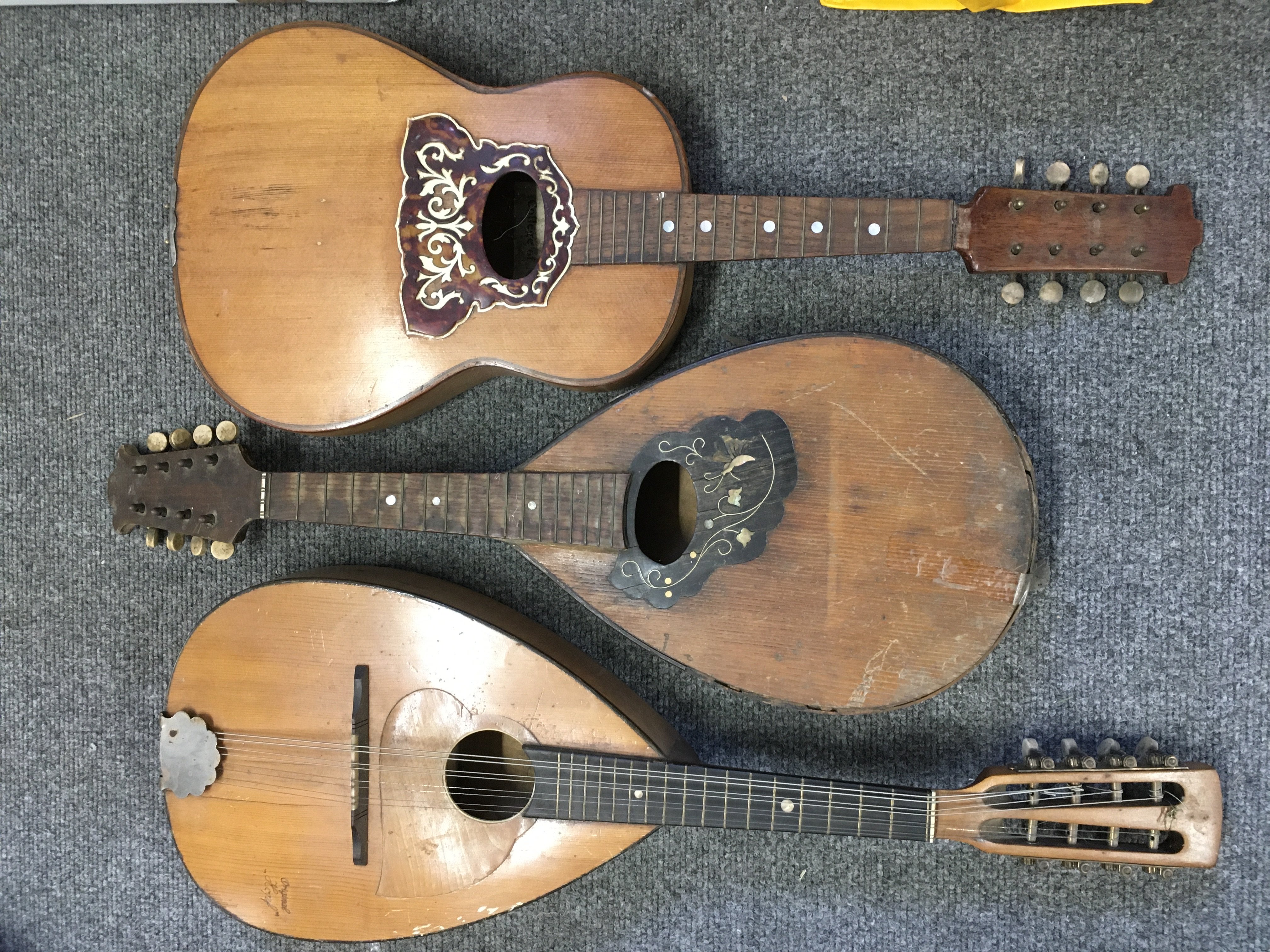 A small collection of mandolins and a ukulele.