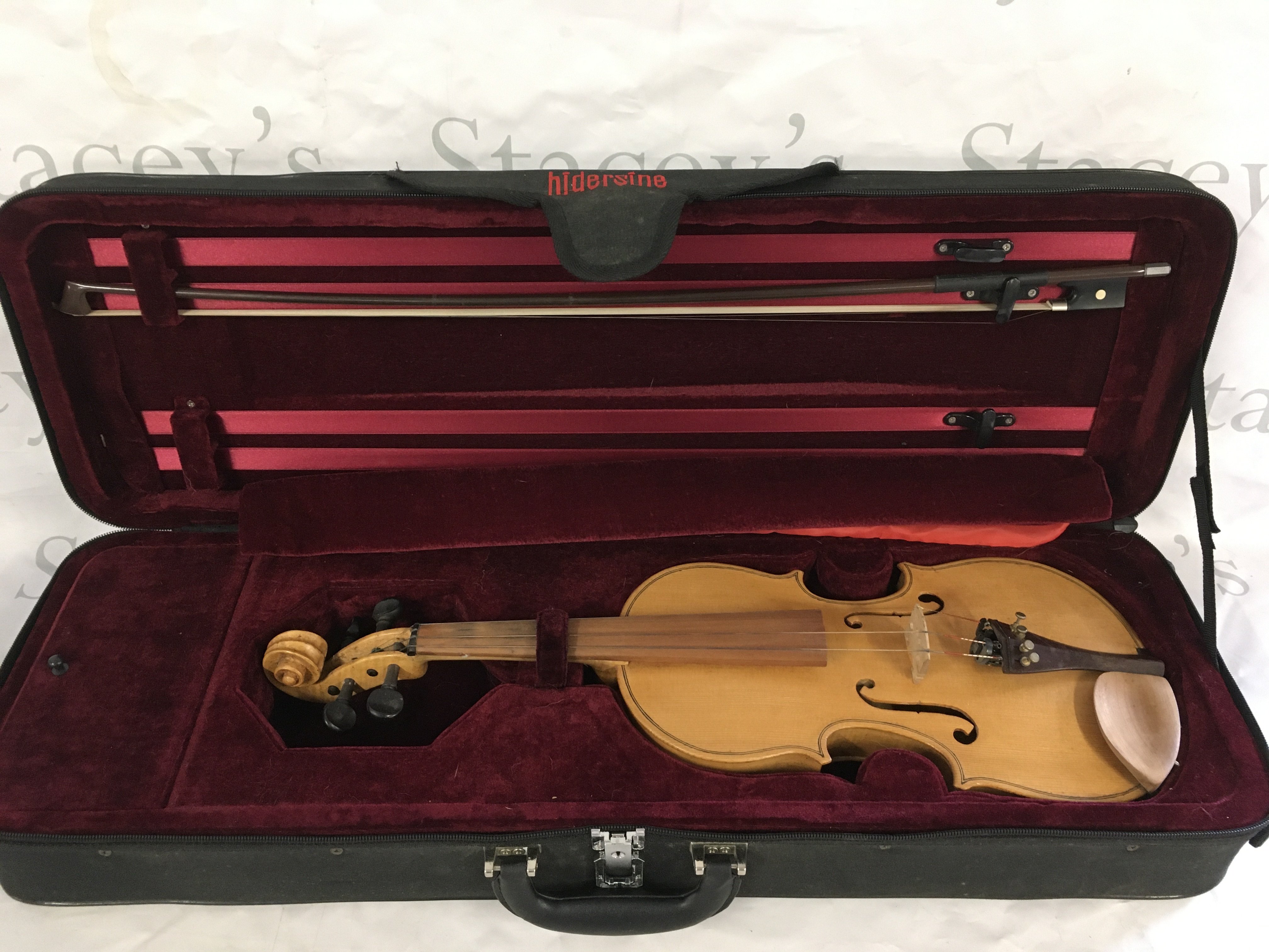 A cased Victor Gonzalez violin and bow.