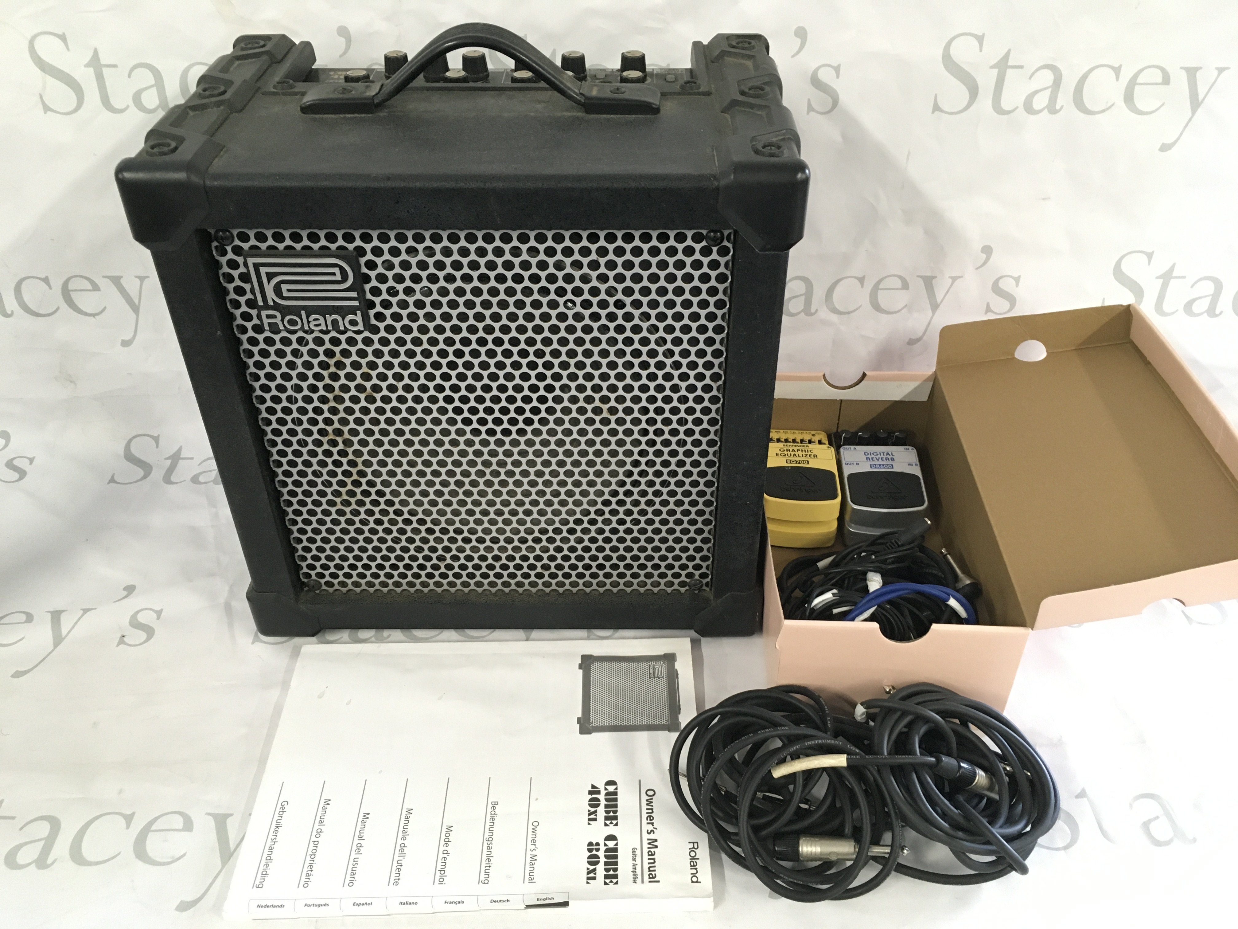 A Roland Cube 40XL amplifier and manual plus two Behringer effects pedals etc.