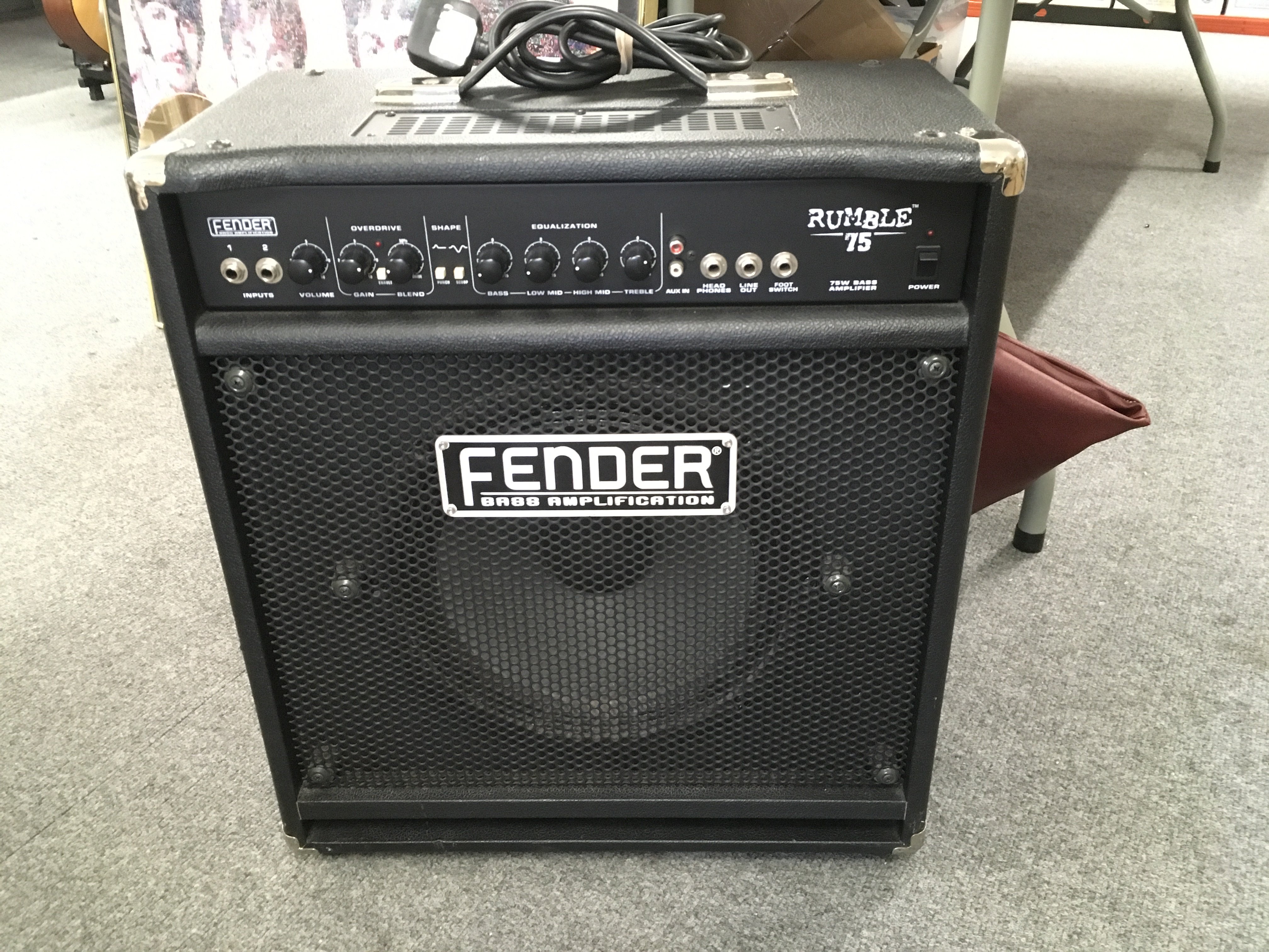 A Fender Rumble 75 bass amp and cover.