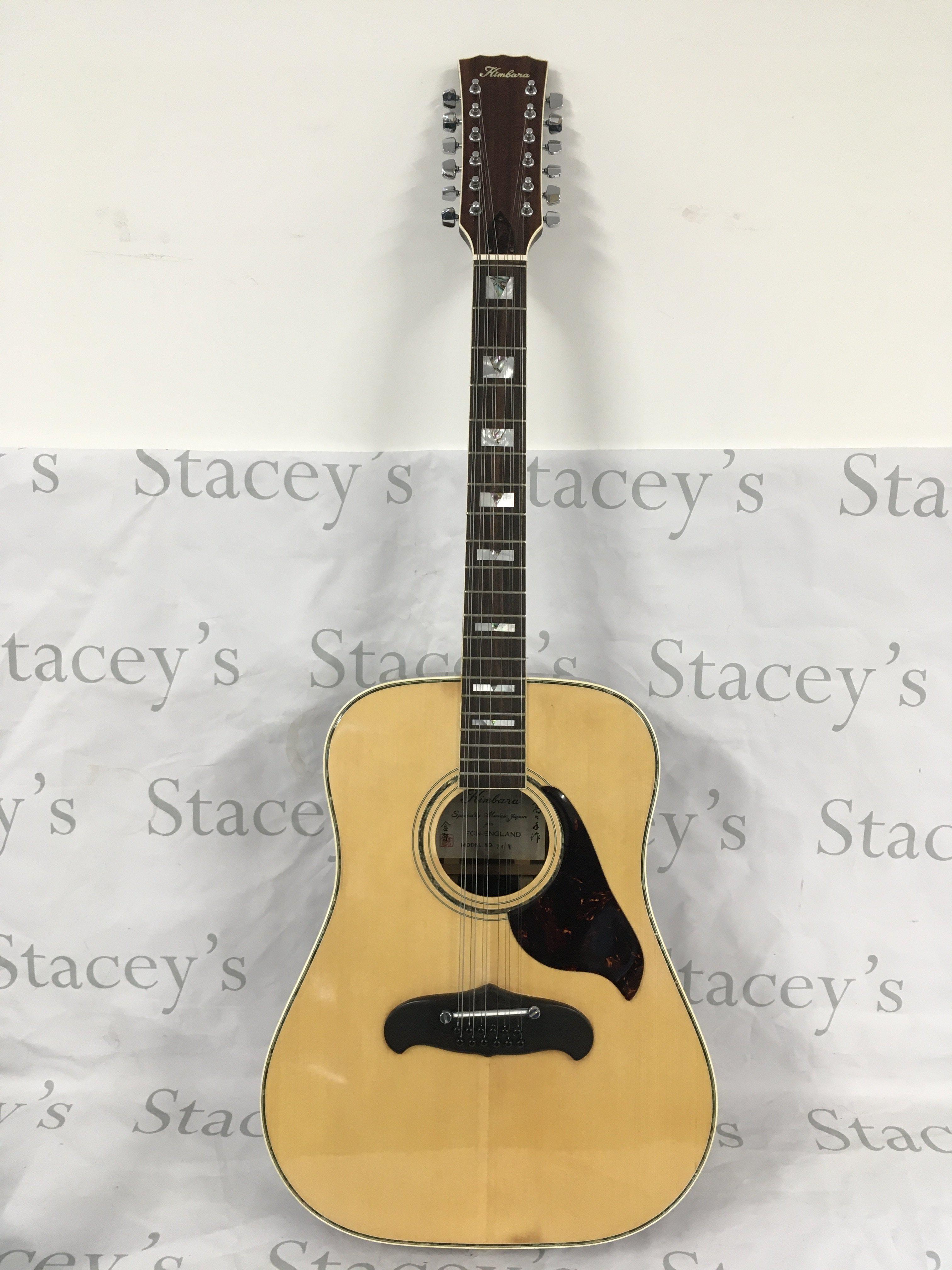 A Kimbara 12 string acoustic guitar with soft carry case.