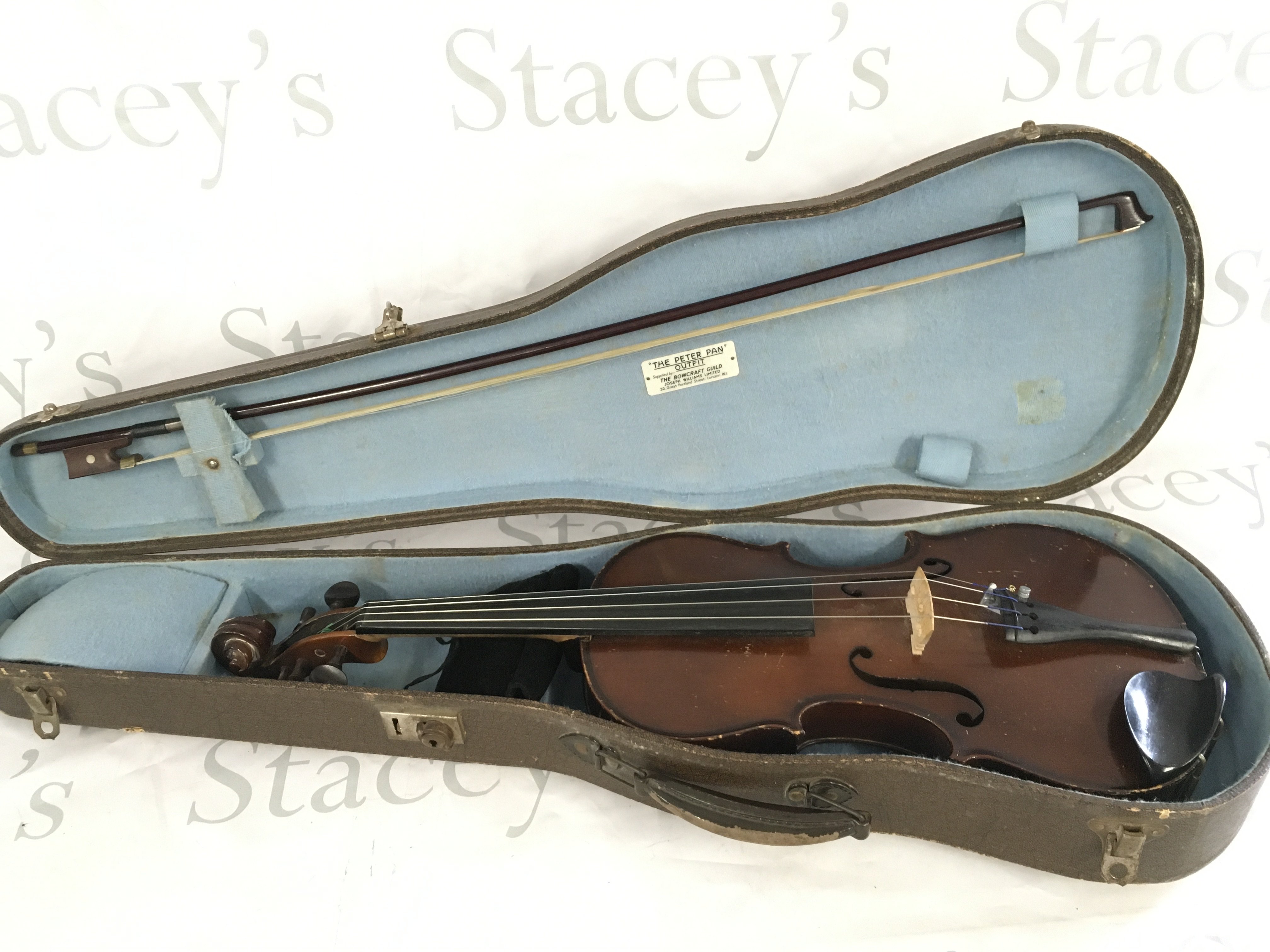 A cased violin and bow. No label inside soundhole.