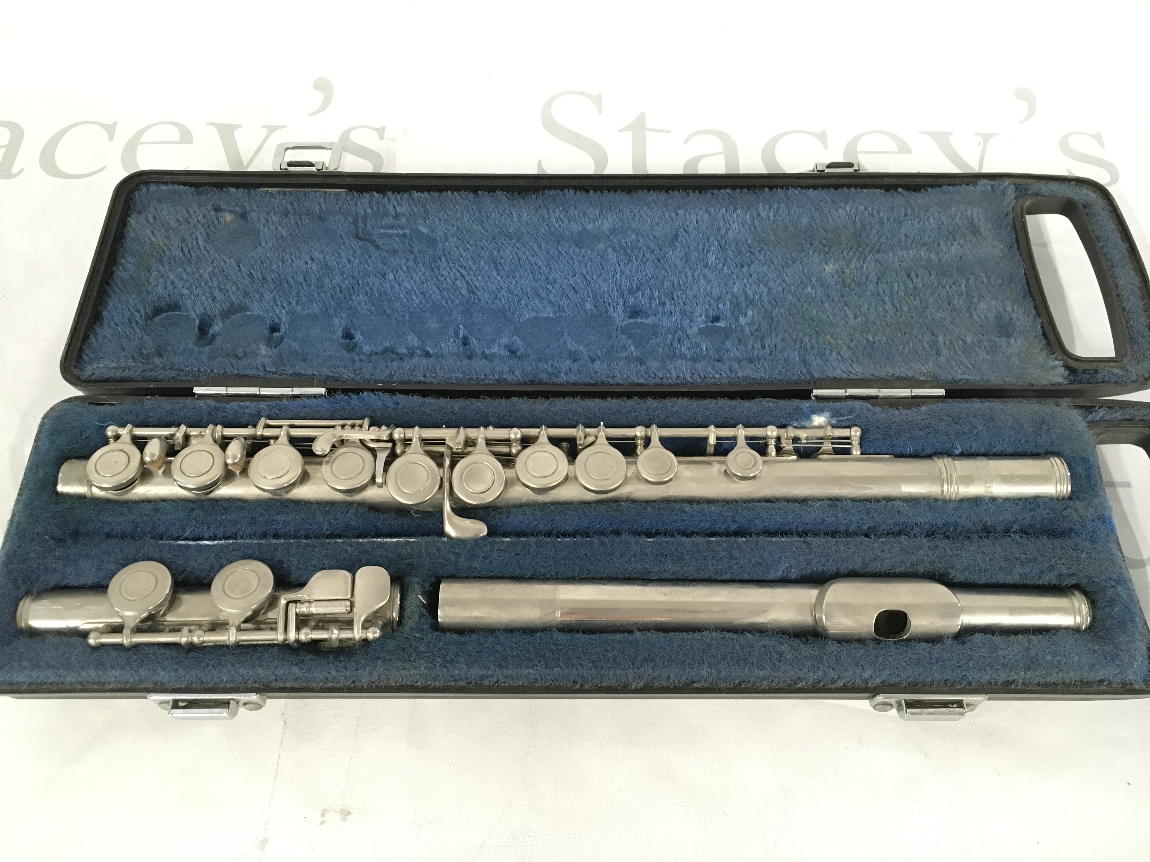 A cased Yamaha flute.