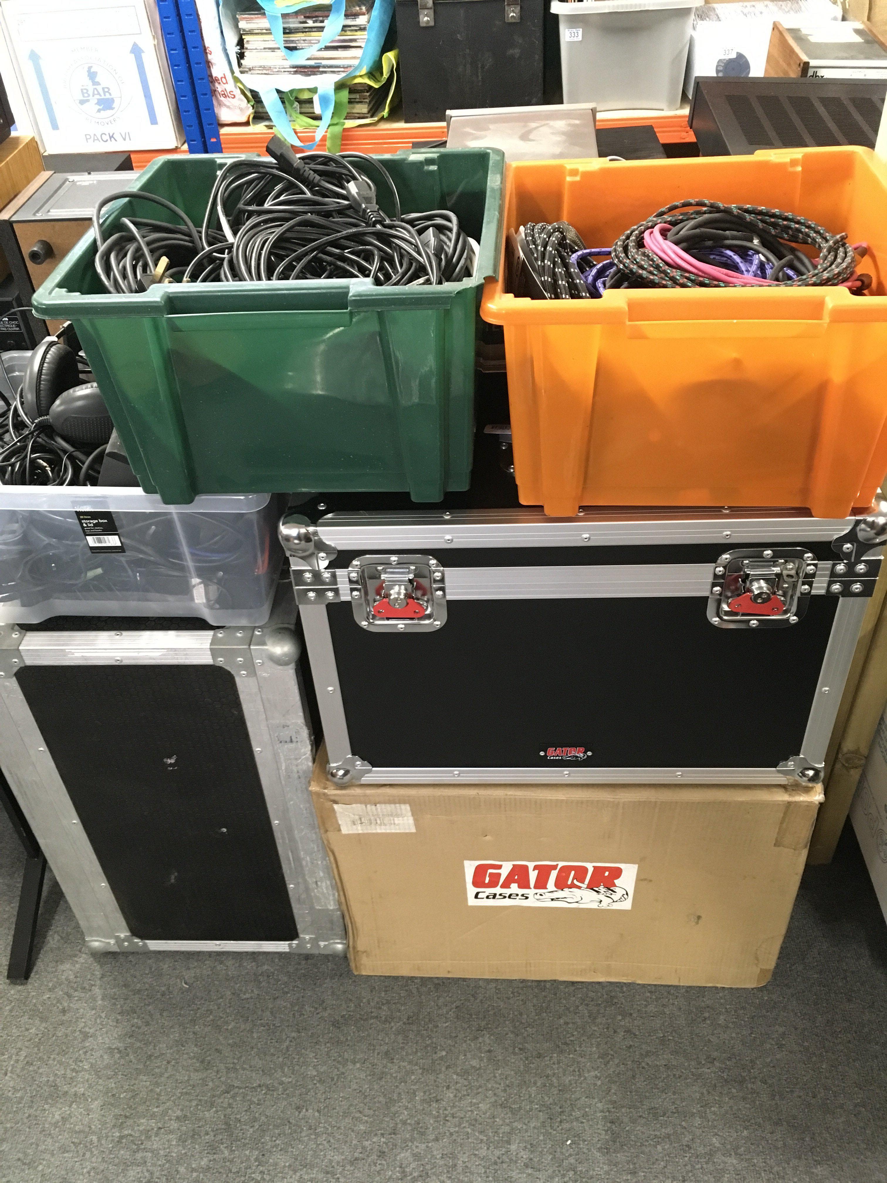 A brand new Gator case plus one other case plus various leads and stands.