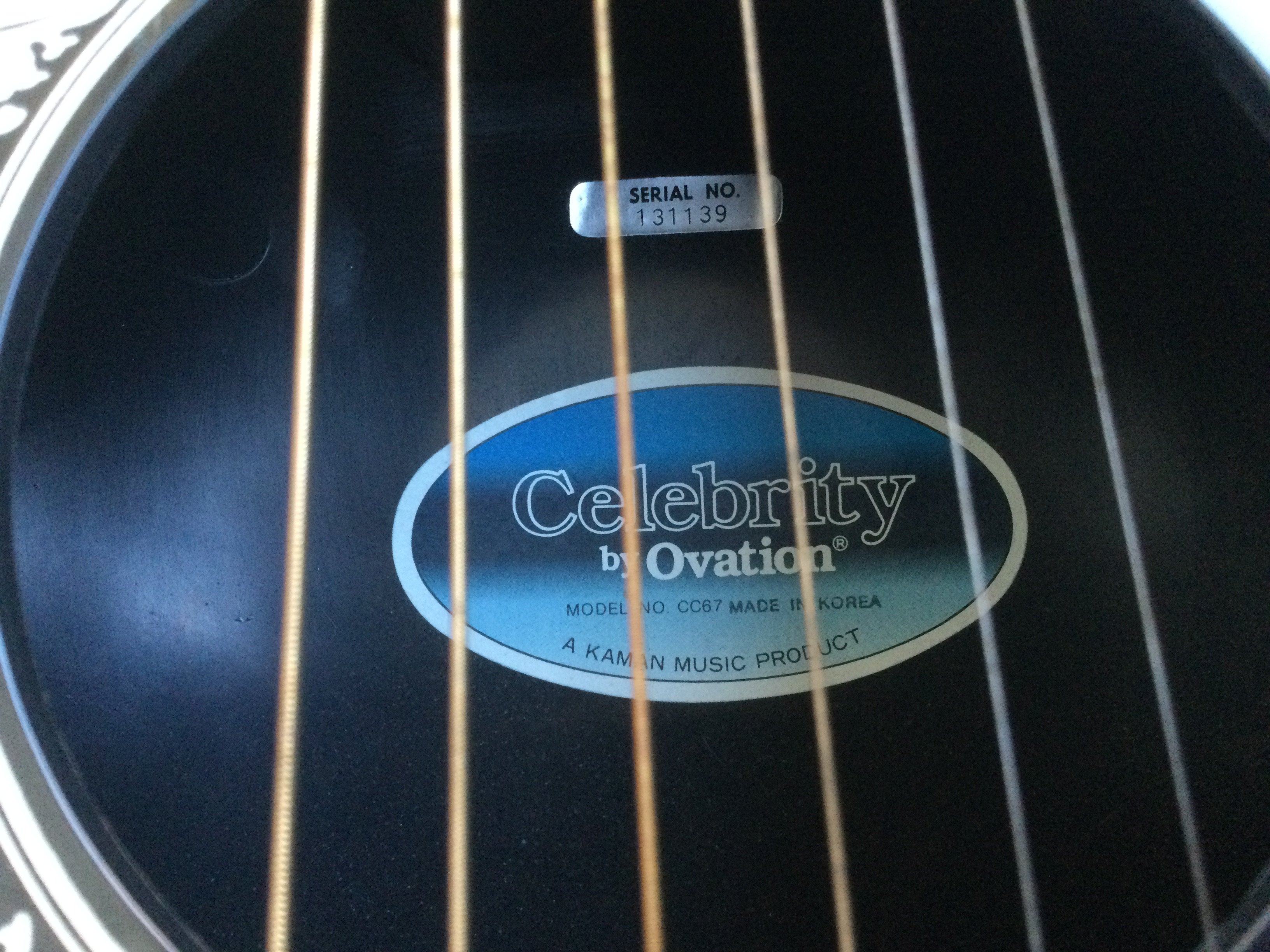 An Ovation Celebrity bowl back acoustic guitar with hard carry case.
