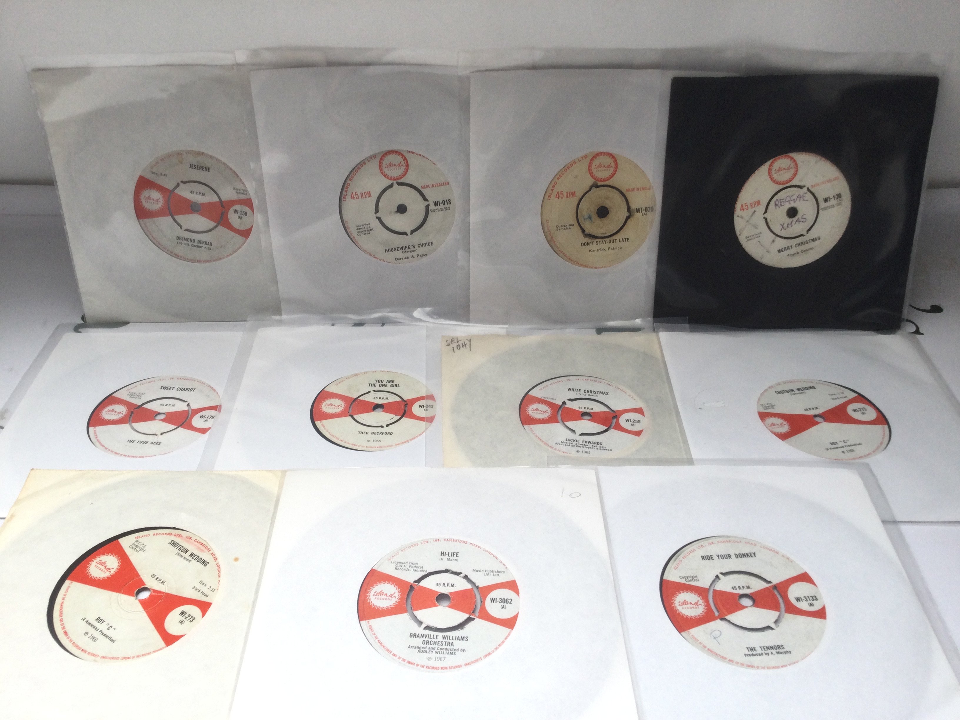 Eleven rare and collectable Island label 7" singles by various artists including Desmond Dekkar * And His Cherry Pies, The Four Aces and others.
