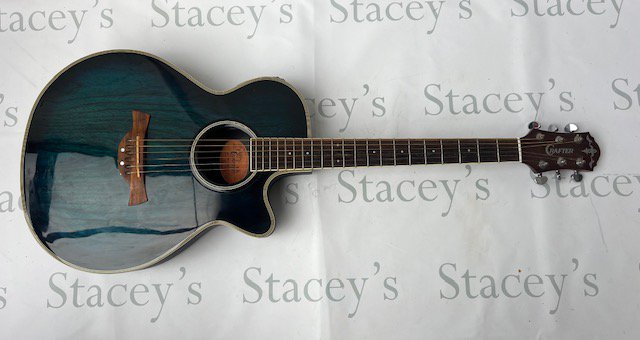 A Crafter FX550EQ Electro Acoustic Guitar with LR Baggs internal pickup and preamp. Translucent dark turquoise blue. Unplayed with no evidence of playwear or fretwear. No case.