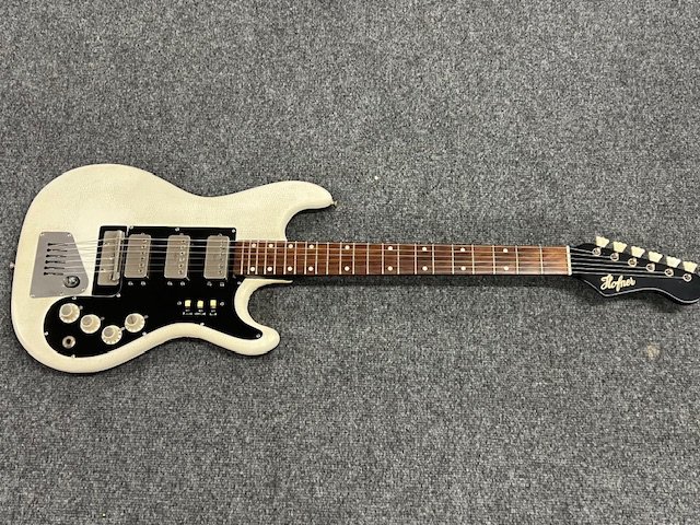 A 1963 Hofner Galaxie 175 ELectric Guitar all original with vinyl covering. Missing vibrato arm. Comes with non original hard case, Click Here to Register to bid