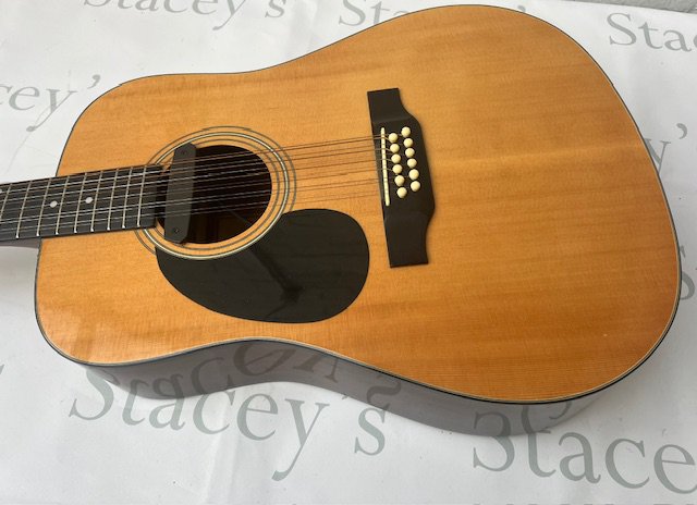 A Tanglewood TW1200 12 string left handed acoustic guitar with added Fishman sound hole pickup. In very good overall condition with no marking and light fret wear.