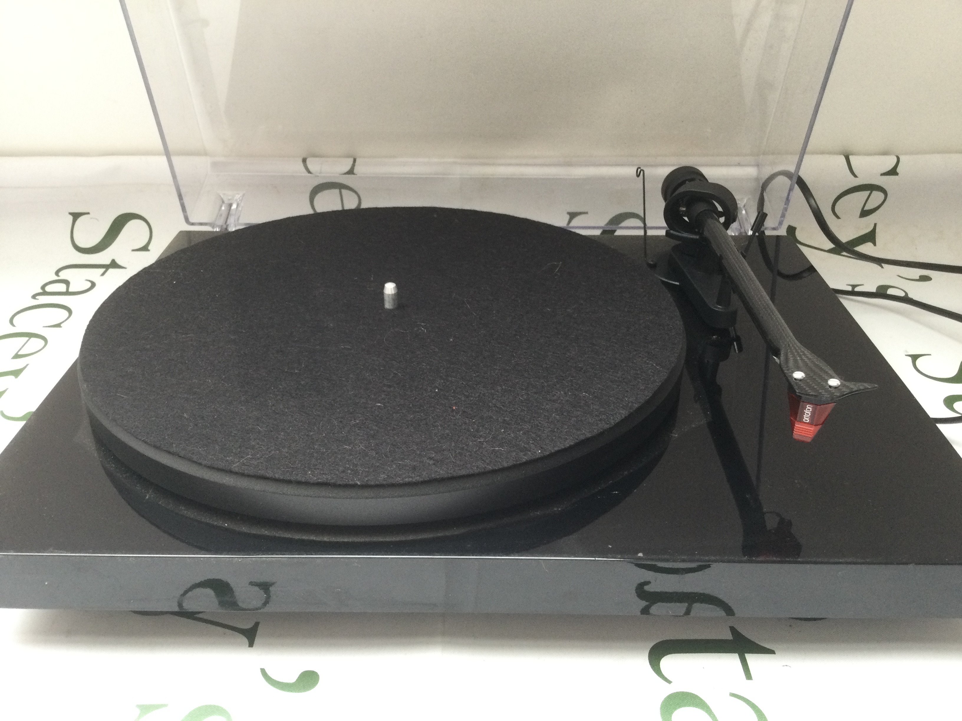 A Pro-Ject Carbon turntable with various cables.