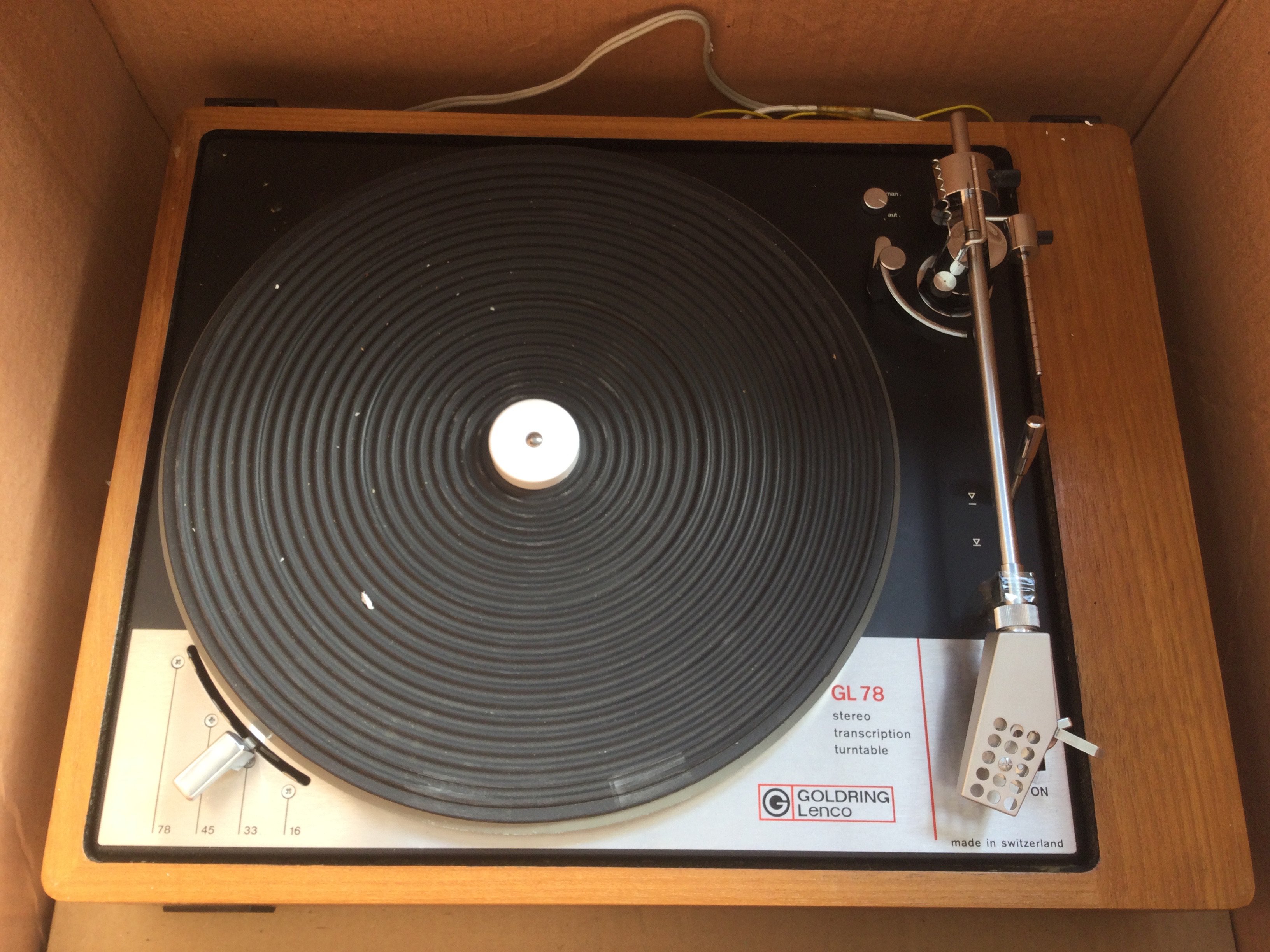 A collection of HiFi equipment comprising a boxed 1970s Goldring Lenco GL78 turntable, a Goodmans one ten tuner, a Trio cassette deck, a pair of Wharfedale Dovedale 3 floor standing speakers and Tripletone TSH 1500 headphones. Includes some cables.