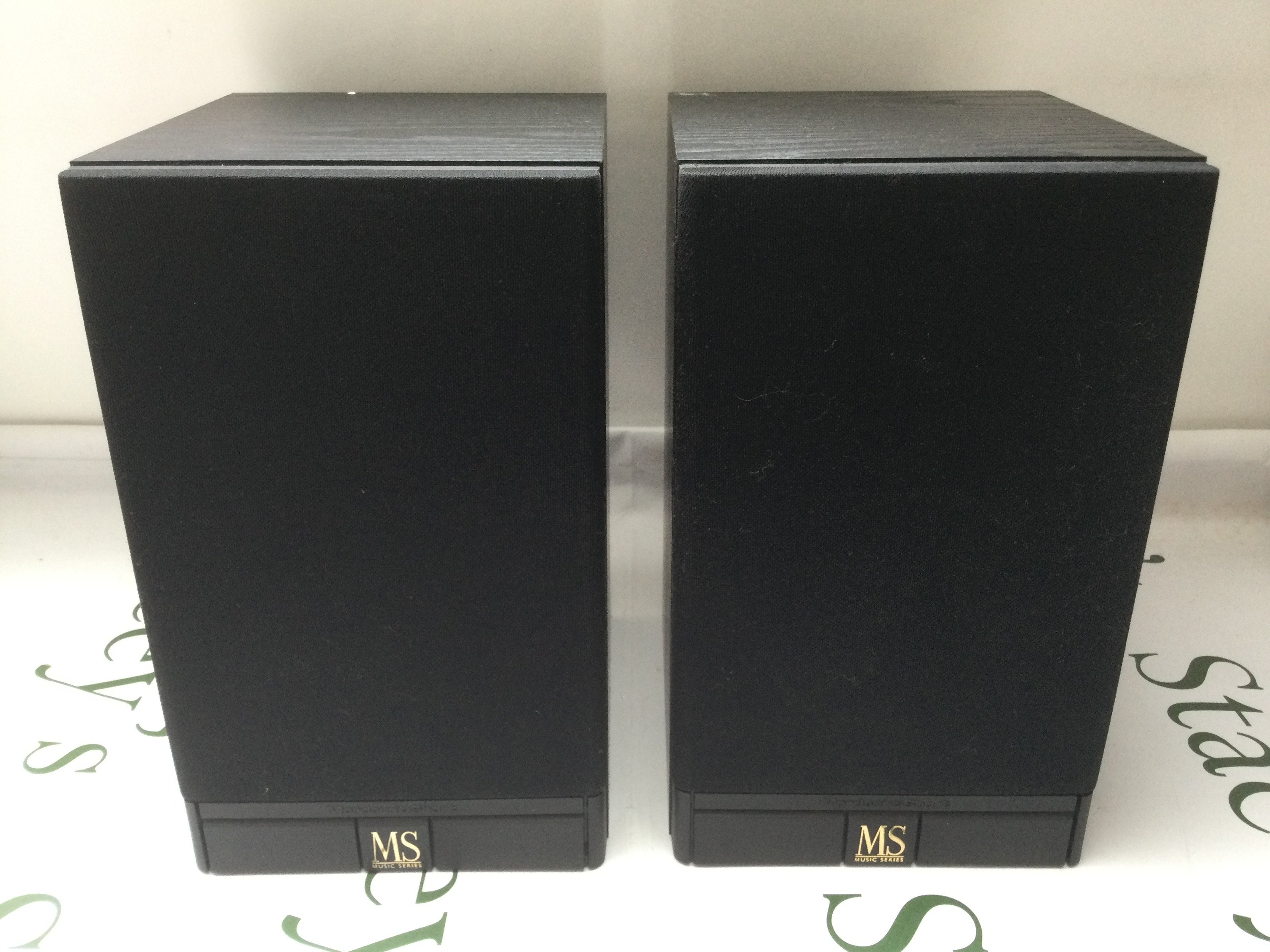 A boxed pair of Mordaunt Short MS10i bookshelf speakers.