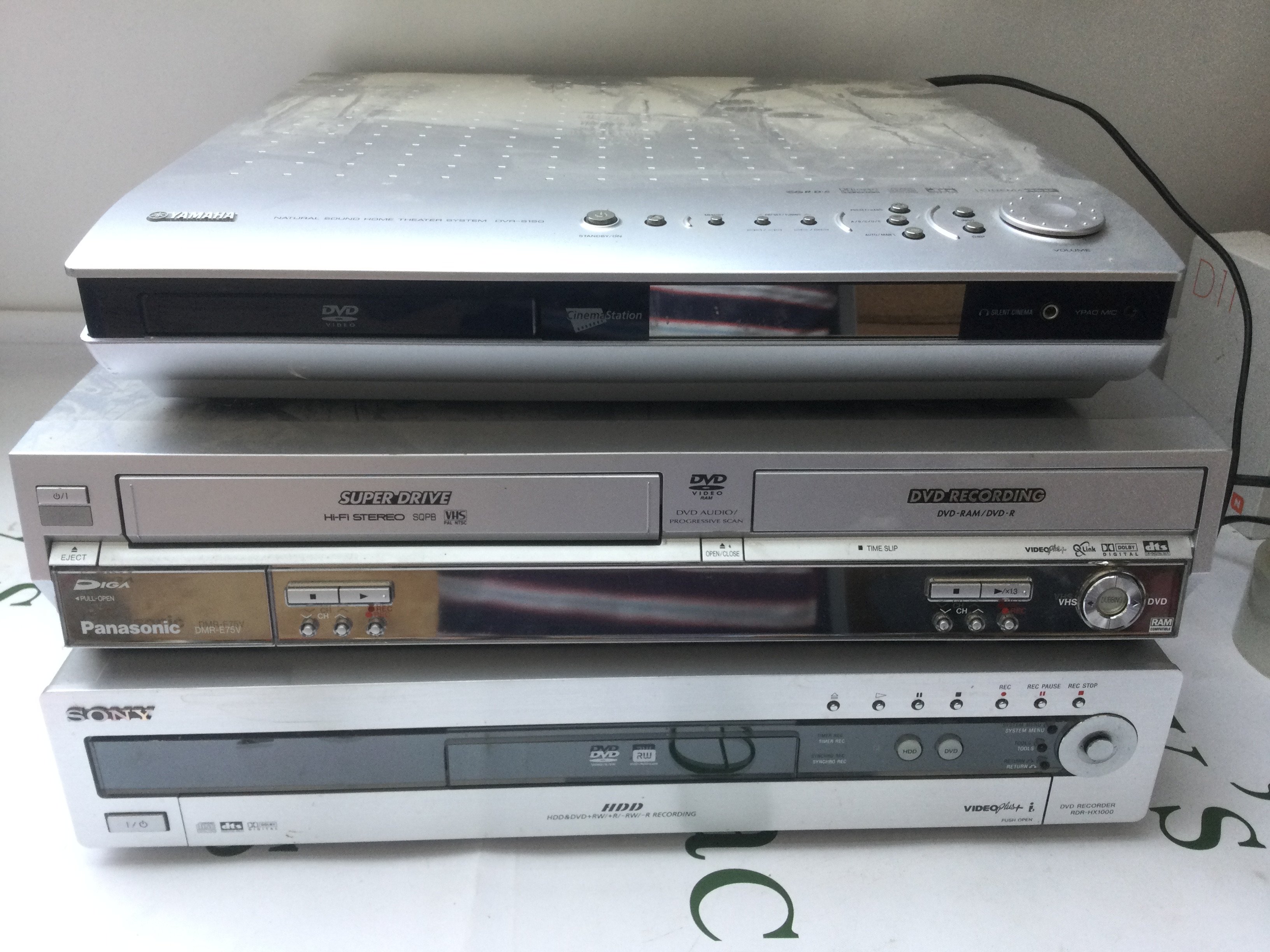 A pair of Linn floorstanding speakers and a box of audio visual equipment.