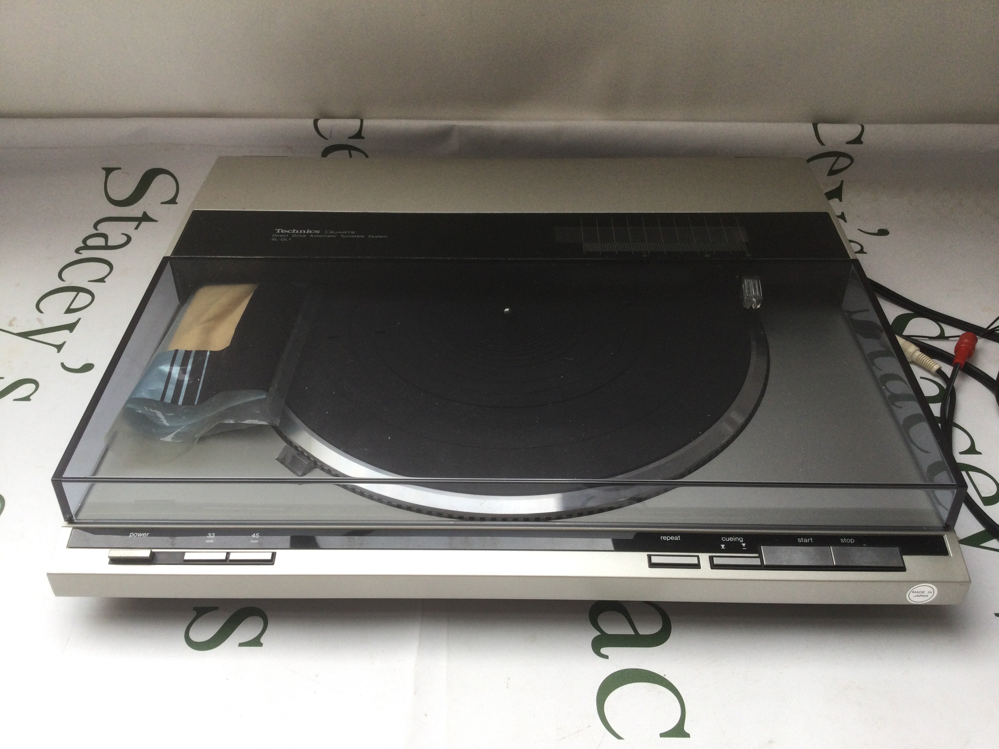 A Technics SL-QL1 direct drive turntable.