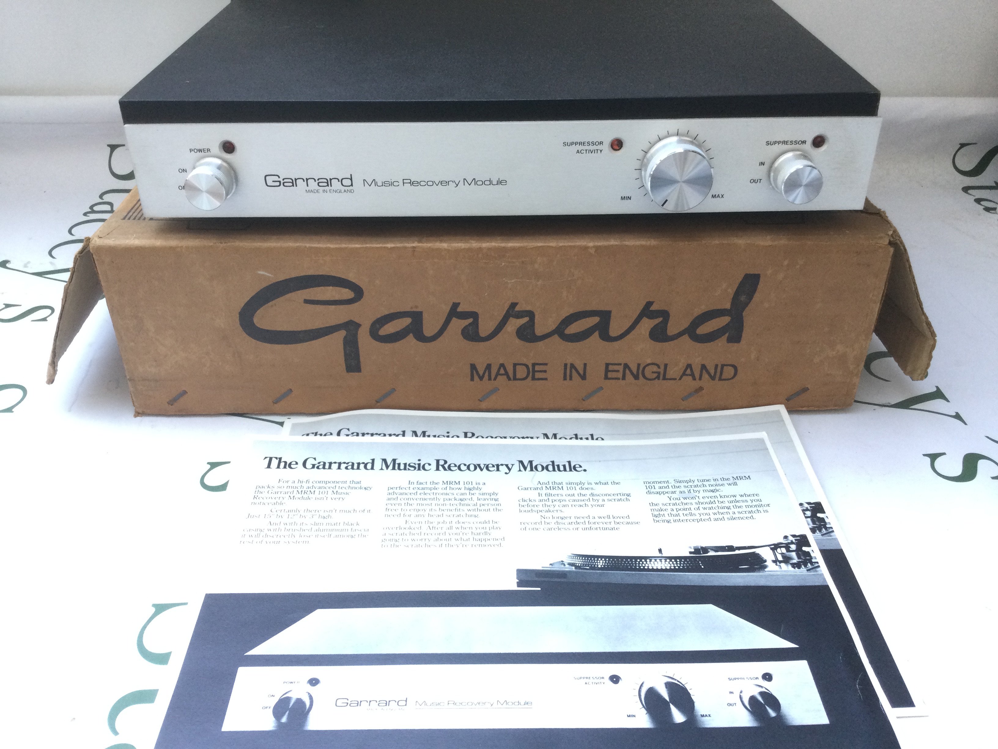 A boxed Garrard MRM 101 music recovery module, designed to suppress clicks and pops on playback of old vinyl. Comes with manuals.