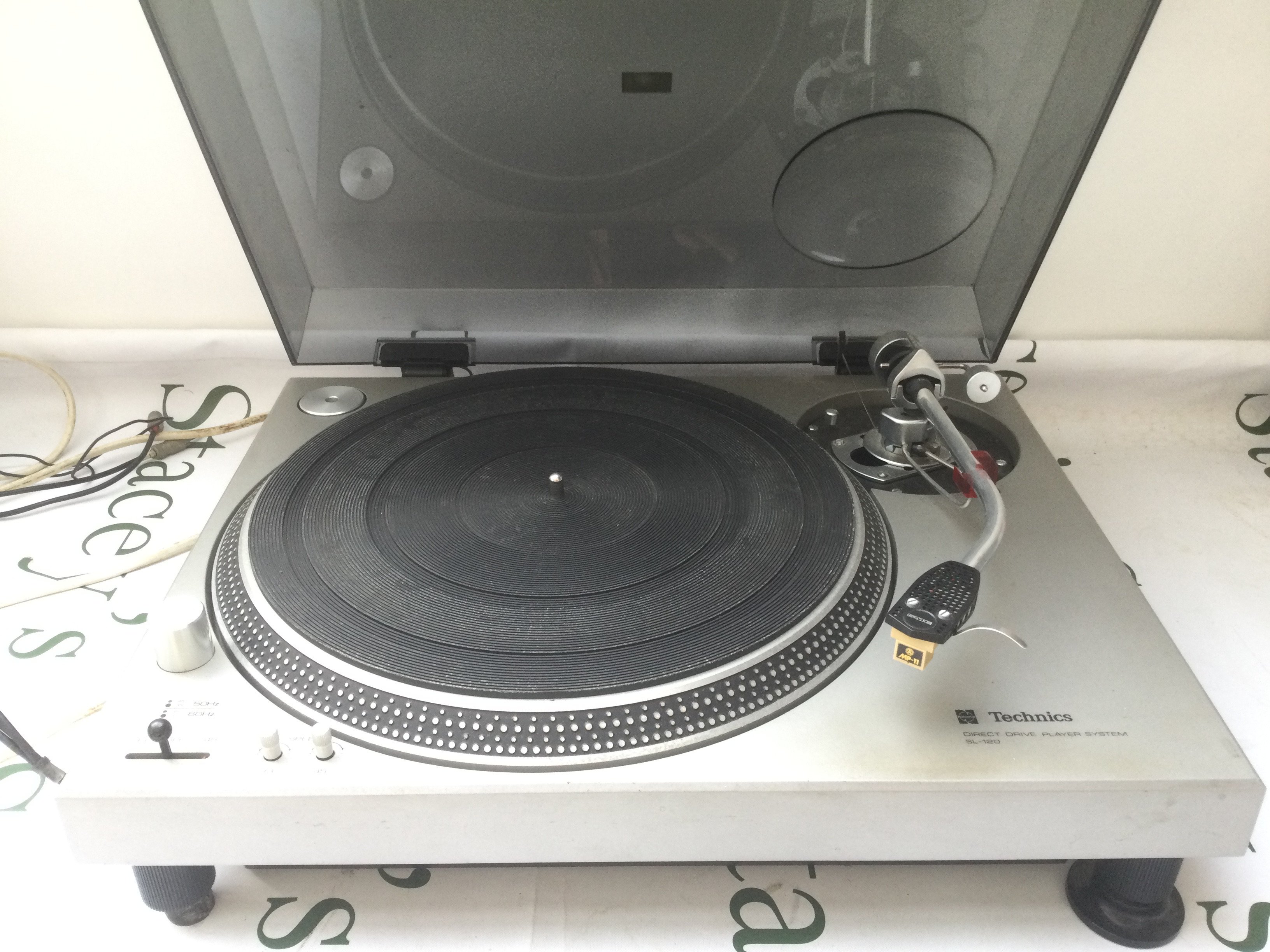 A Technics SL-120 direct drive turntable fitted with an SME Series II tonearm. Comes with manuals and accessories.