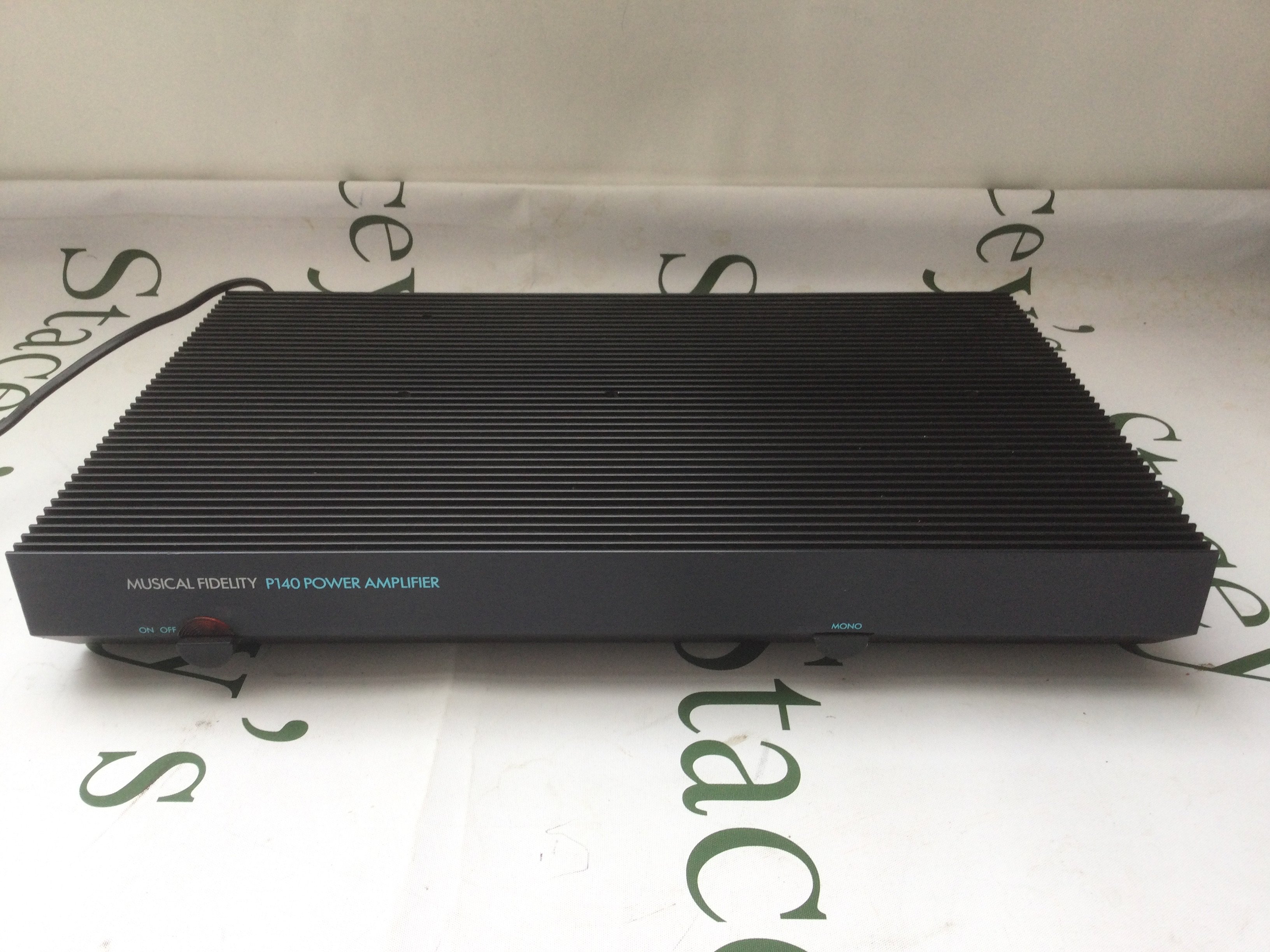 A boxed Musical Fidelity P140 power amp.