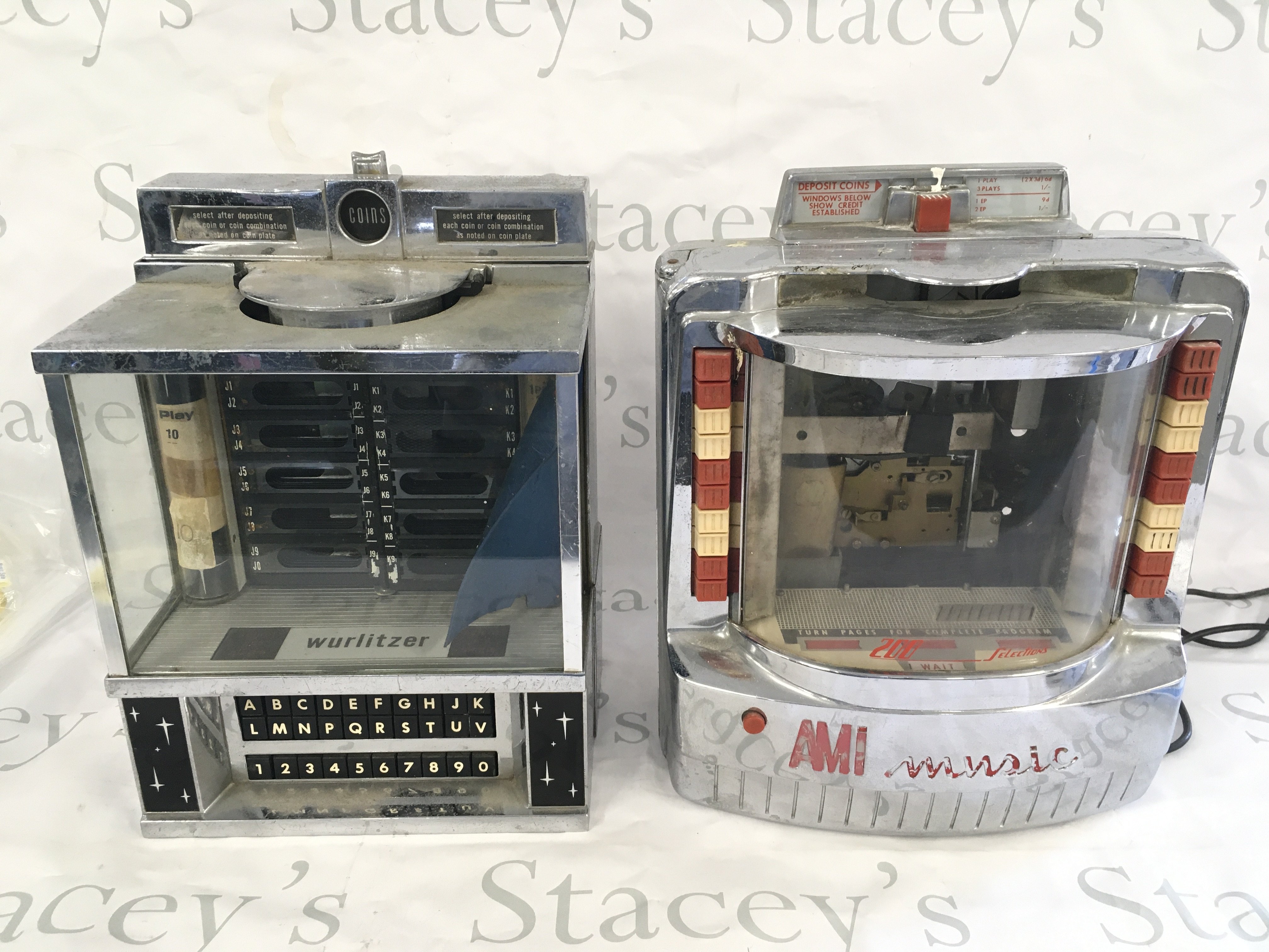 Two jukebox wall boxes for restoration comprising Wurlitzer and AMI examples.