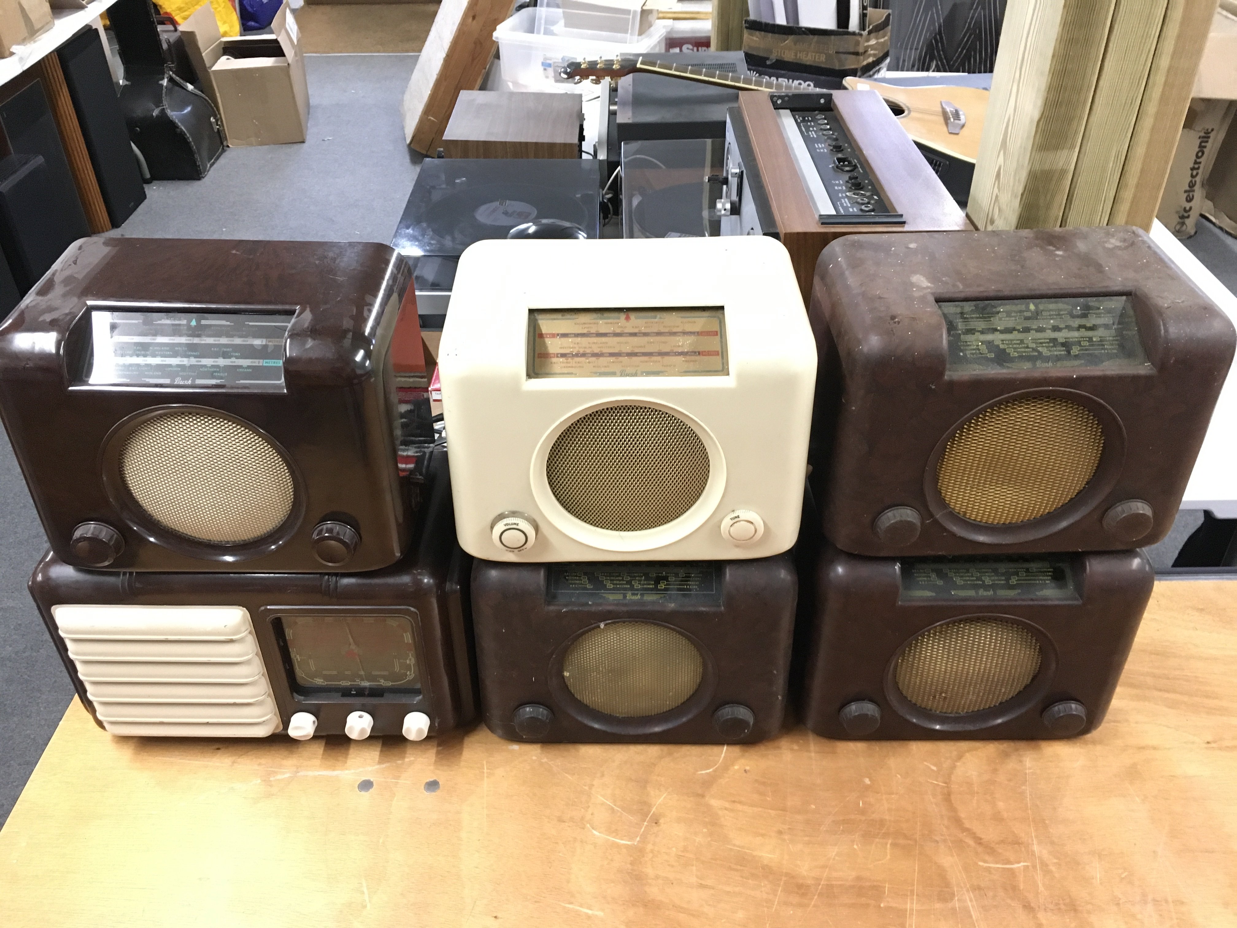 Six Bakelite radios.