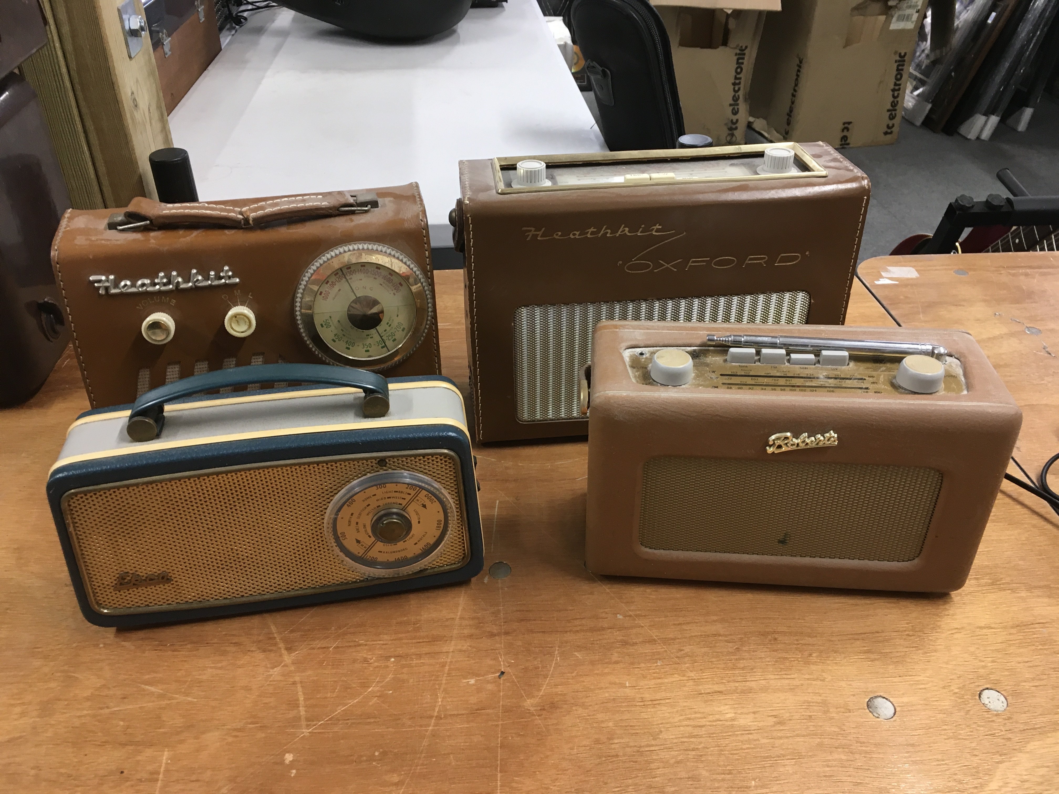 Eight vintage radios comprising Bush, Hacker, Ecko and other examples.