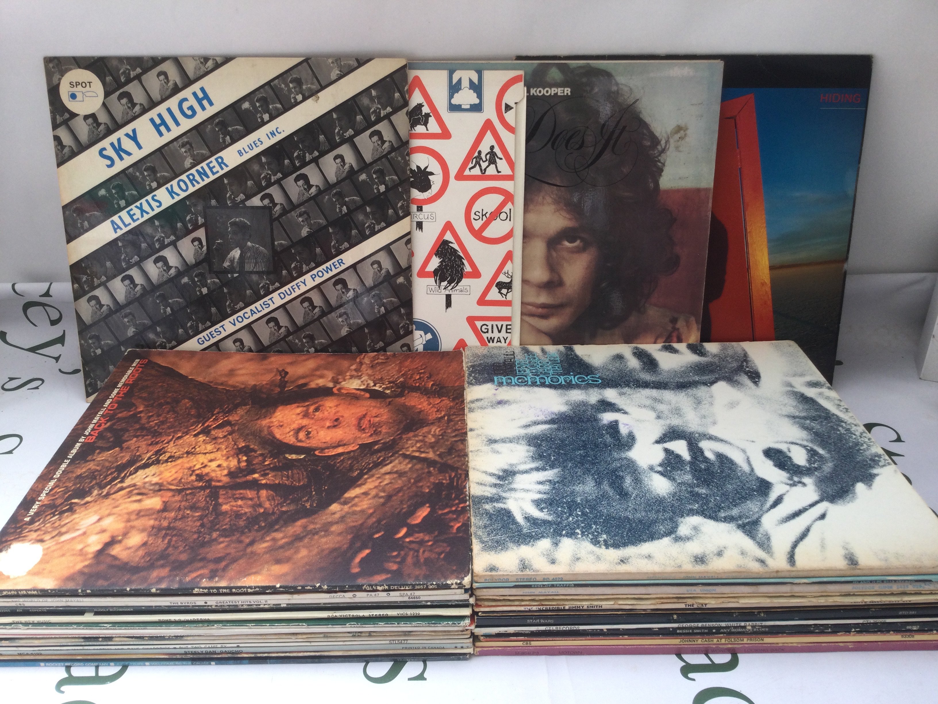 A collection of LPs by various artists including John Mayall, Traffic, Al Kooper and others.