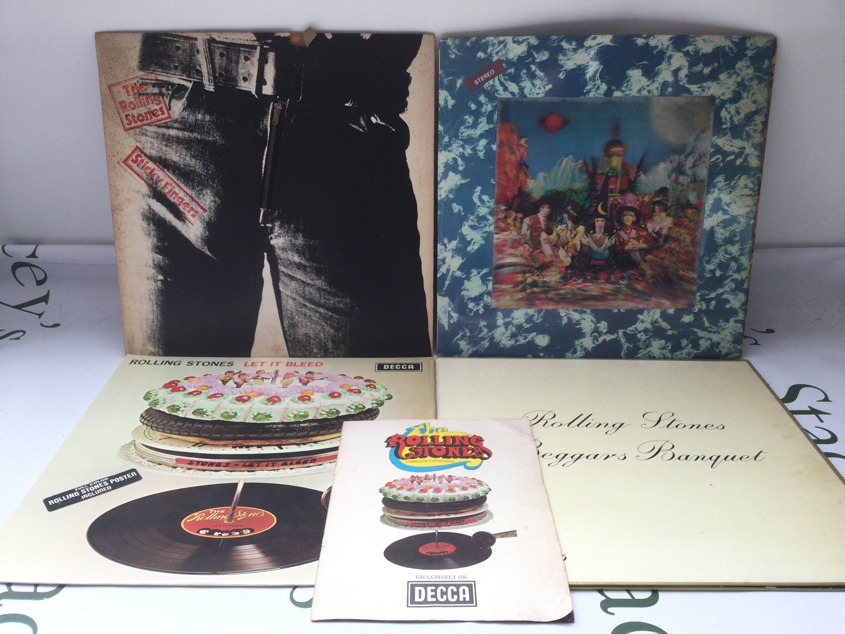 Four early UK pressings of Rolling Stones LPs comprising Their Satanic Majesties Request, Beggars Banquet, Let It Bleed (with poster and catalogue insert) and Sticky Fingers. Condition of vinyl generally Ex but Sticky Fingers and Satanic Majesties need a clean.